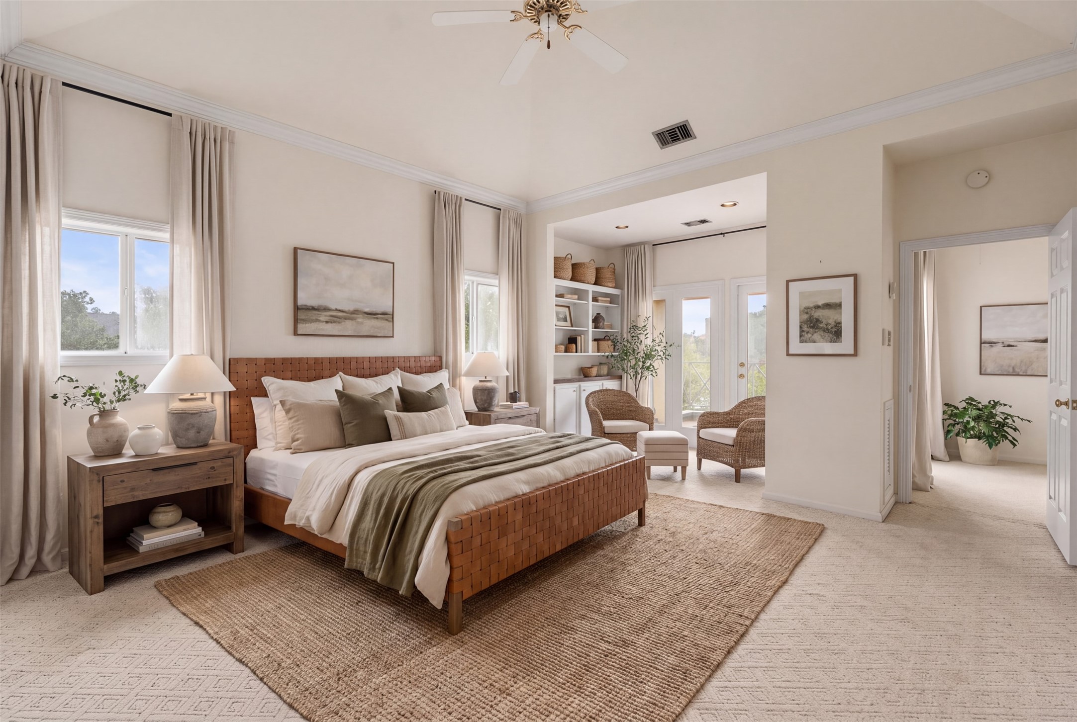 Expansive primary bedroom with vaulted ceiling and sitting area with balcony. 2 closets & 2 separate baths! AI photo to suggest furnishings.