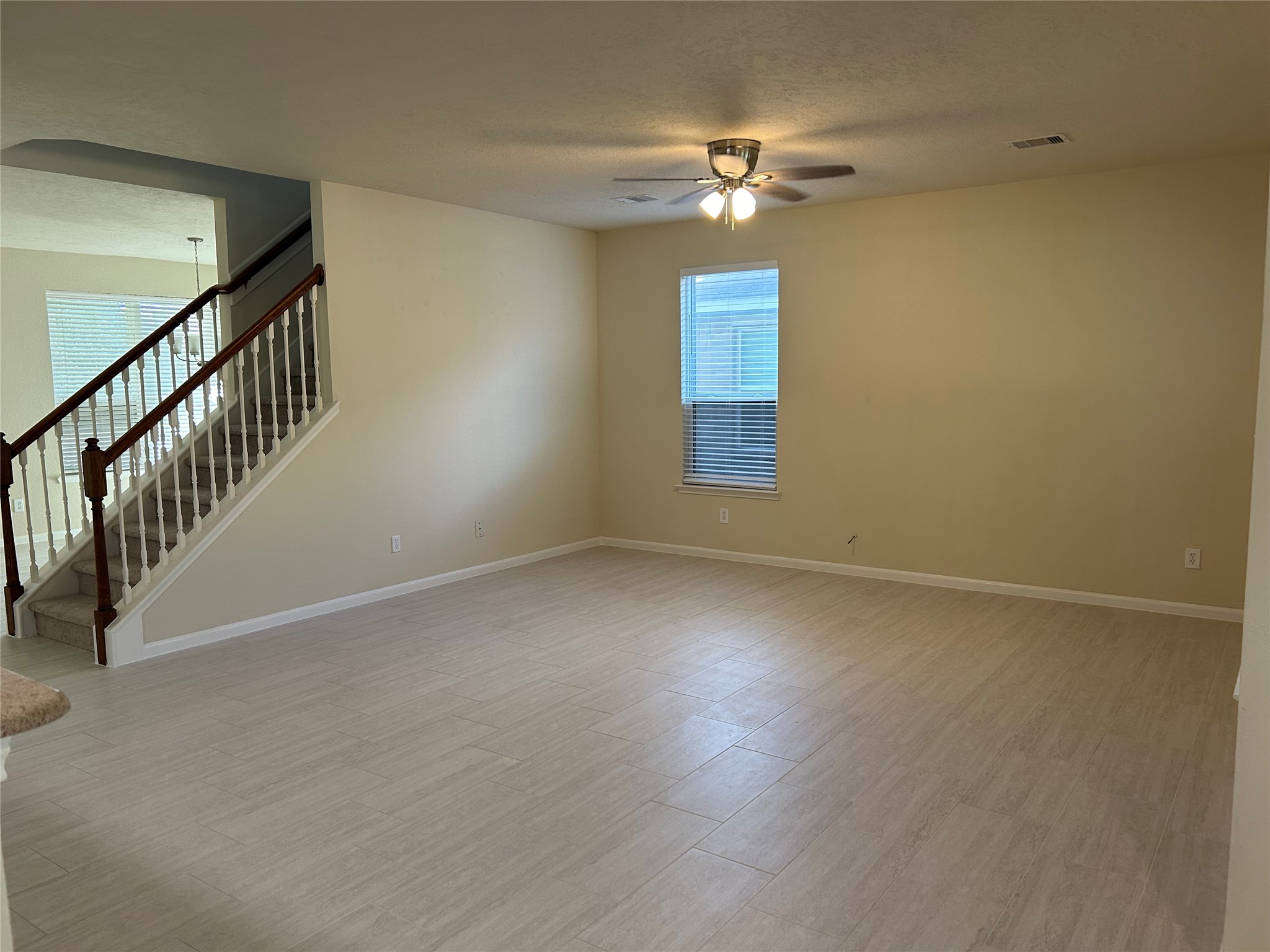 Open view of huge den! Brand new gorgeous tile floors through the entire downstairs!