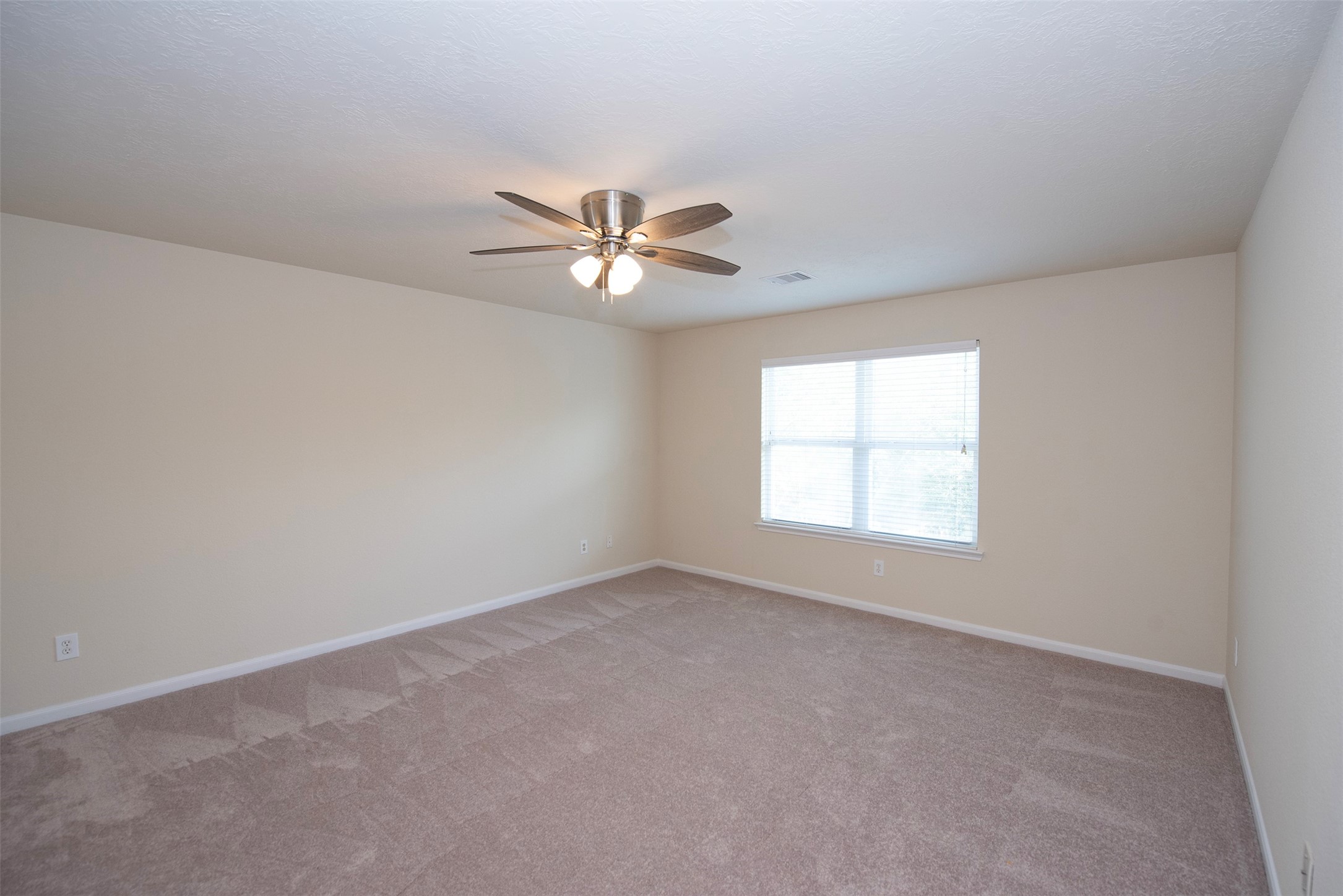 Another view of the game room easily big enough to accommodate a pool table with space to spare.