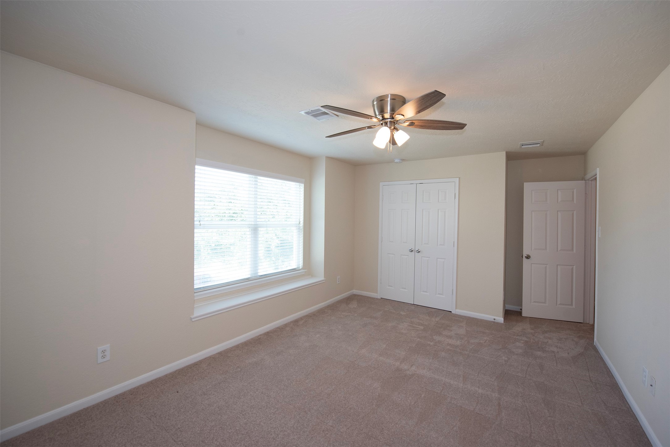 Another view of front room. Room provides a double door closet with fantastic storage.