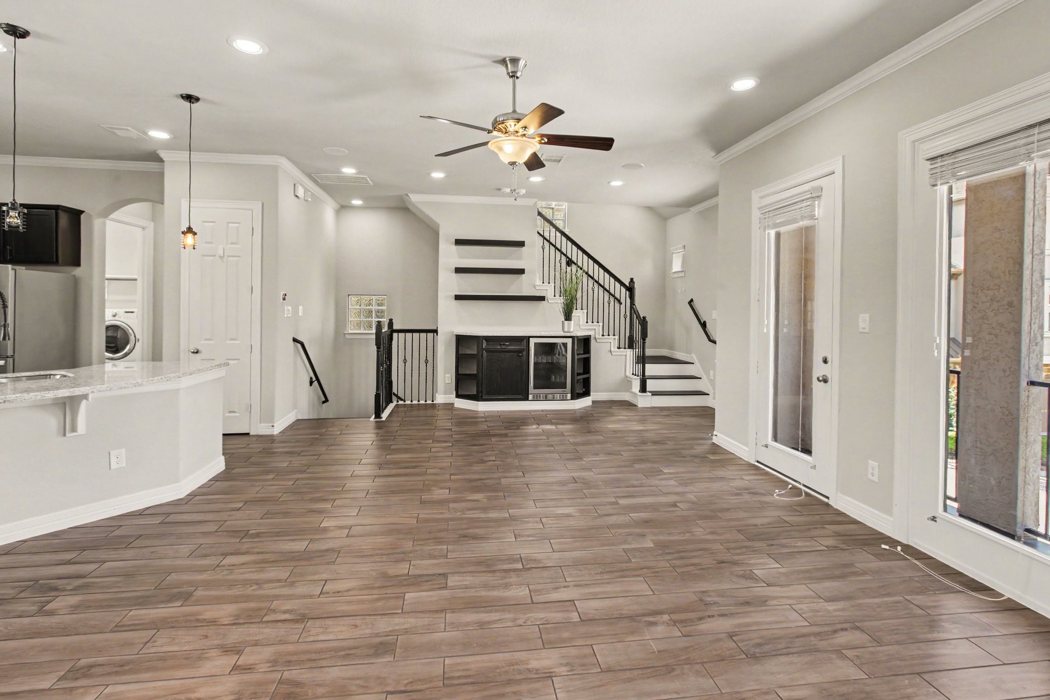 The spacious 2nd floor living area with bar and built-in beverage refrigerator