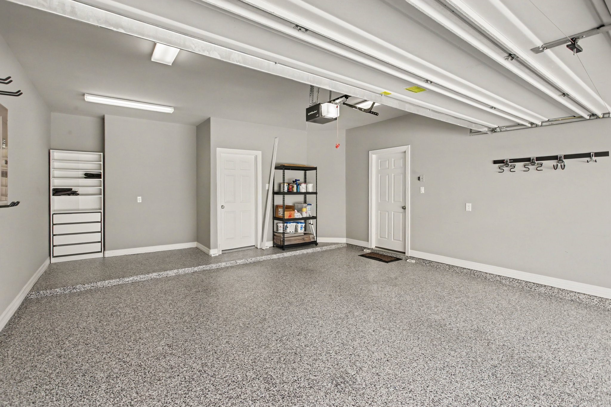 Garage with durable, decorative epoxy flake flooring