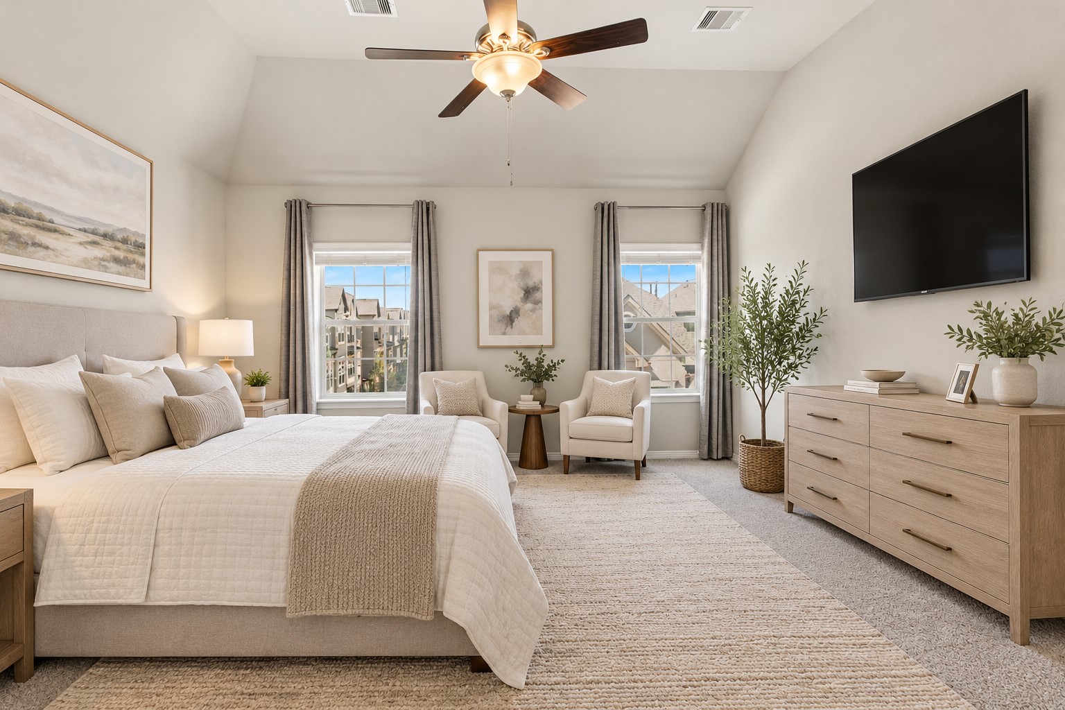 The spacious primary bedroom on the 3rd floor (virtually staged)