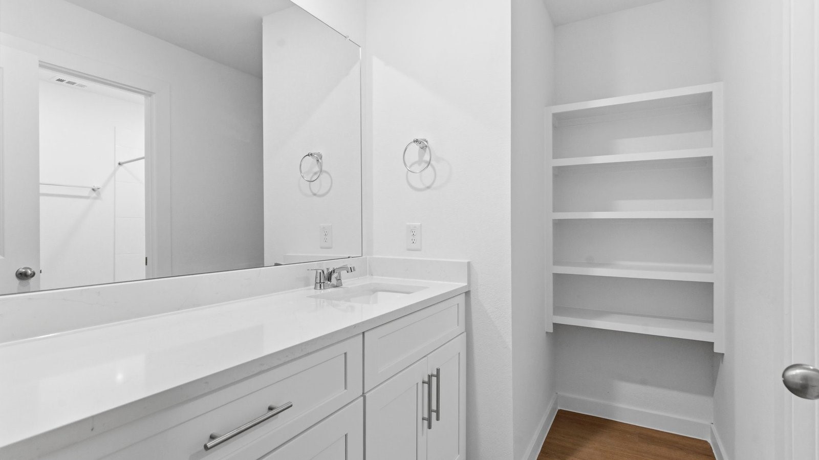 Primary bathroom with a glass-enclosed standing shower and separate soaking tub.