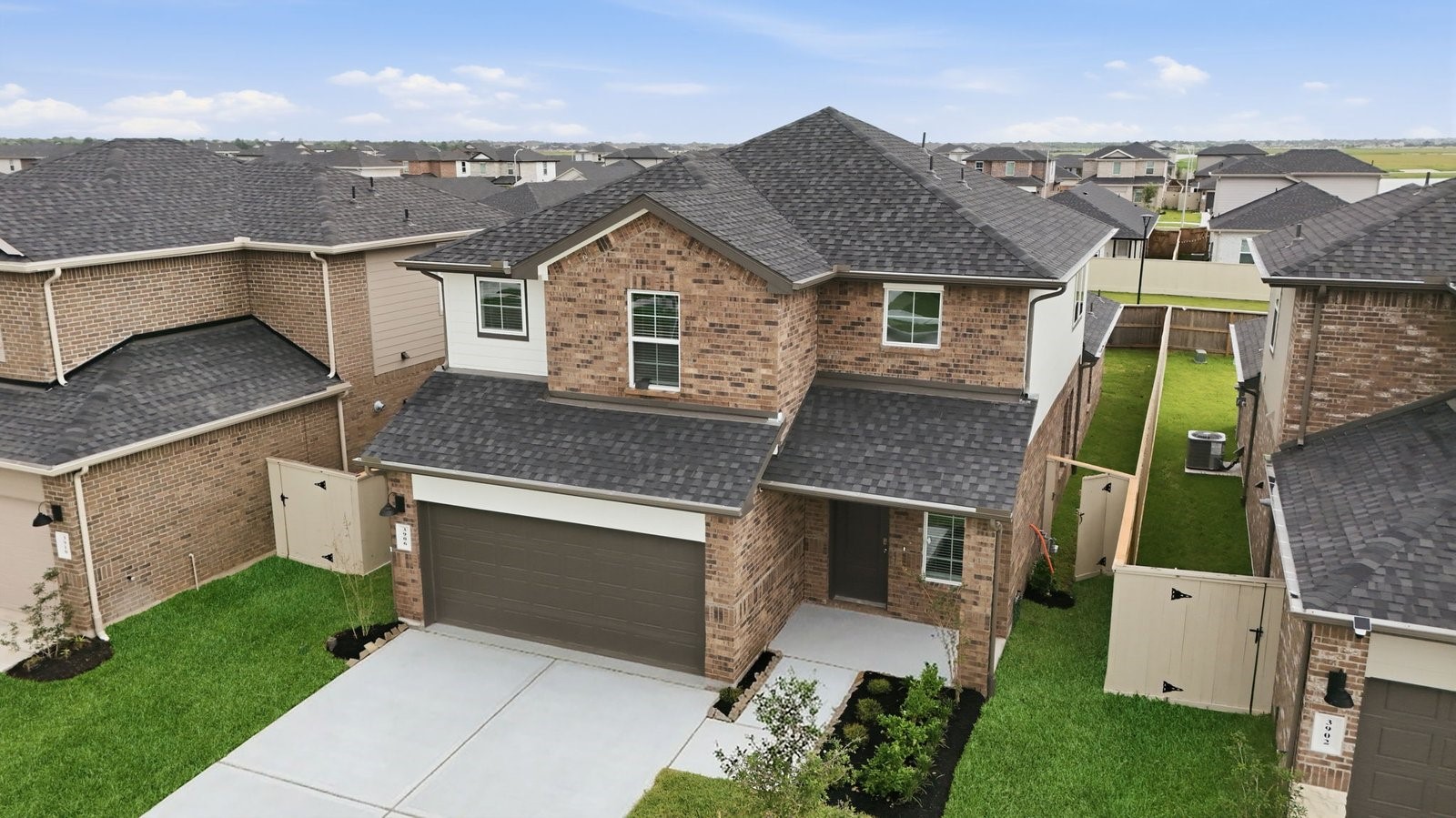 Newly built two story home with traditional architecture, a double garage, and landscaped front yard. Newly built two story home with traditional architecture, a double garage, and landscaped front yard.