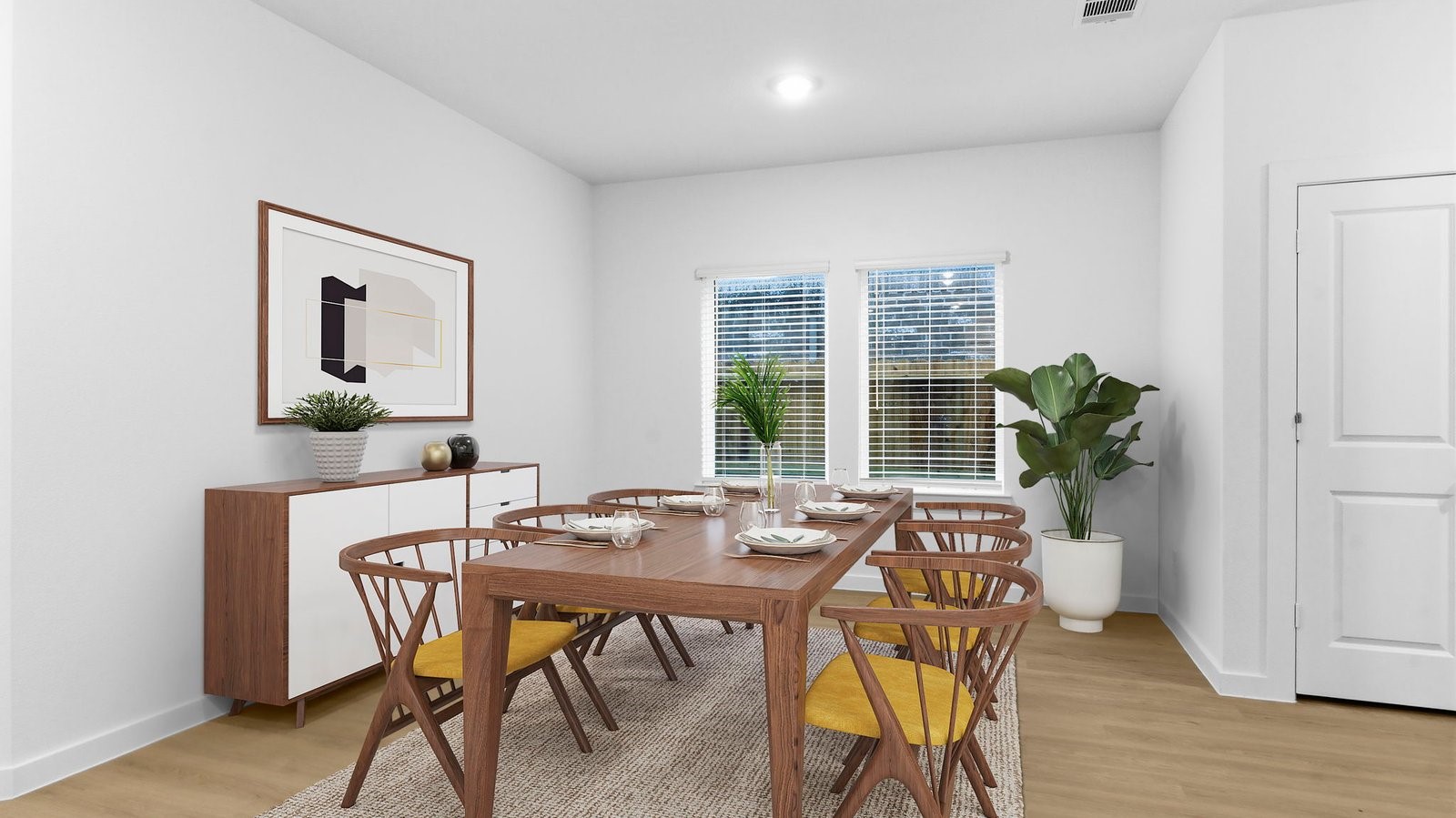 Spacious open concept dining area with vinyl wood flooring and access to the living and kitchen areas