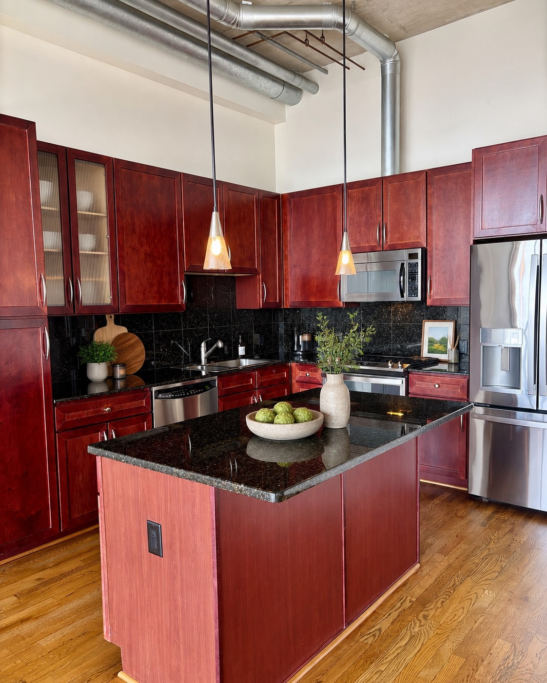 Breakfast bar in the kitchen. Hanging light fixtures and over/under cabinets lights. Stainless steel appliances and abundant storage!