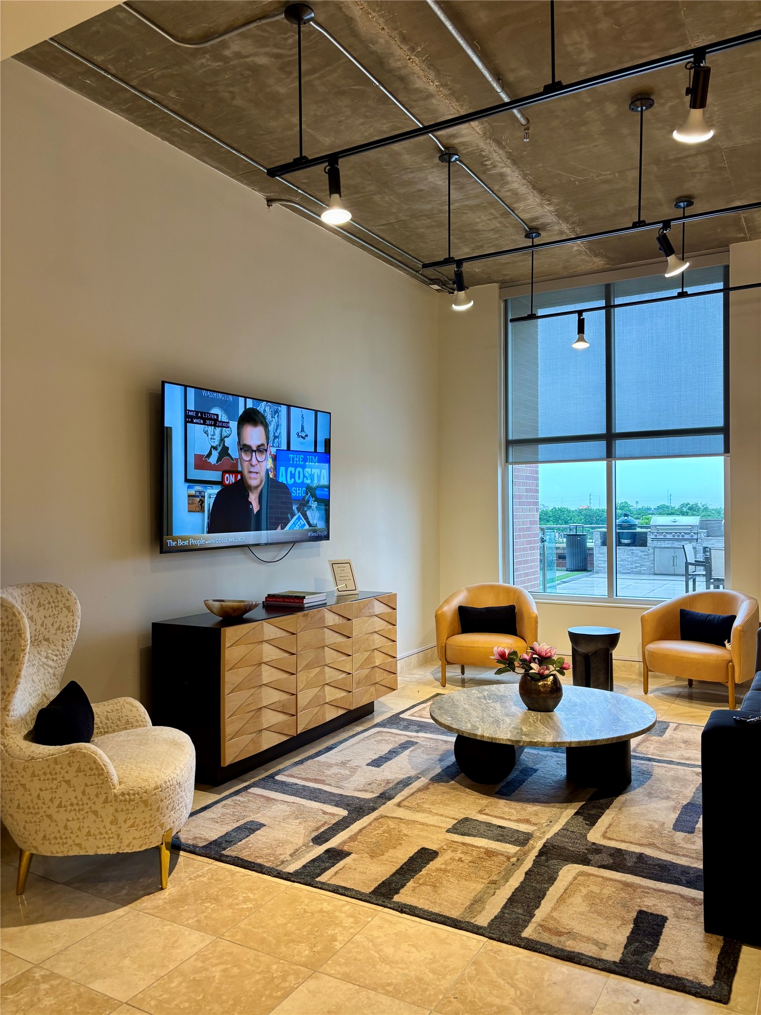 Clubroom seating area. Tables and chairs for gathering. Conference room across the hall.