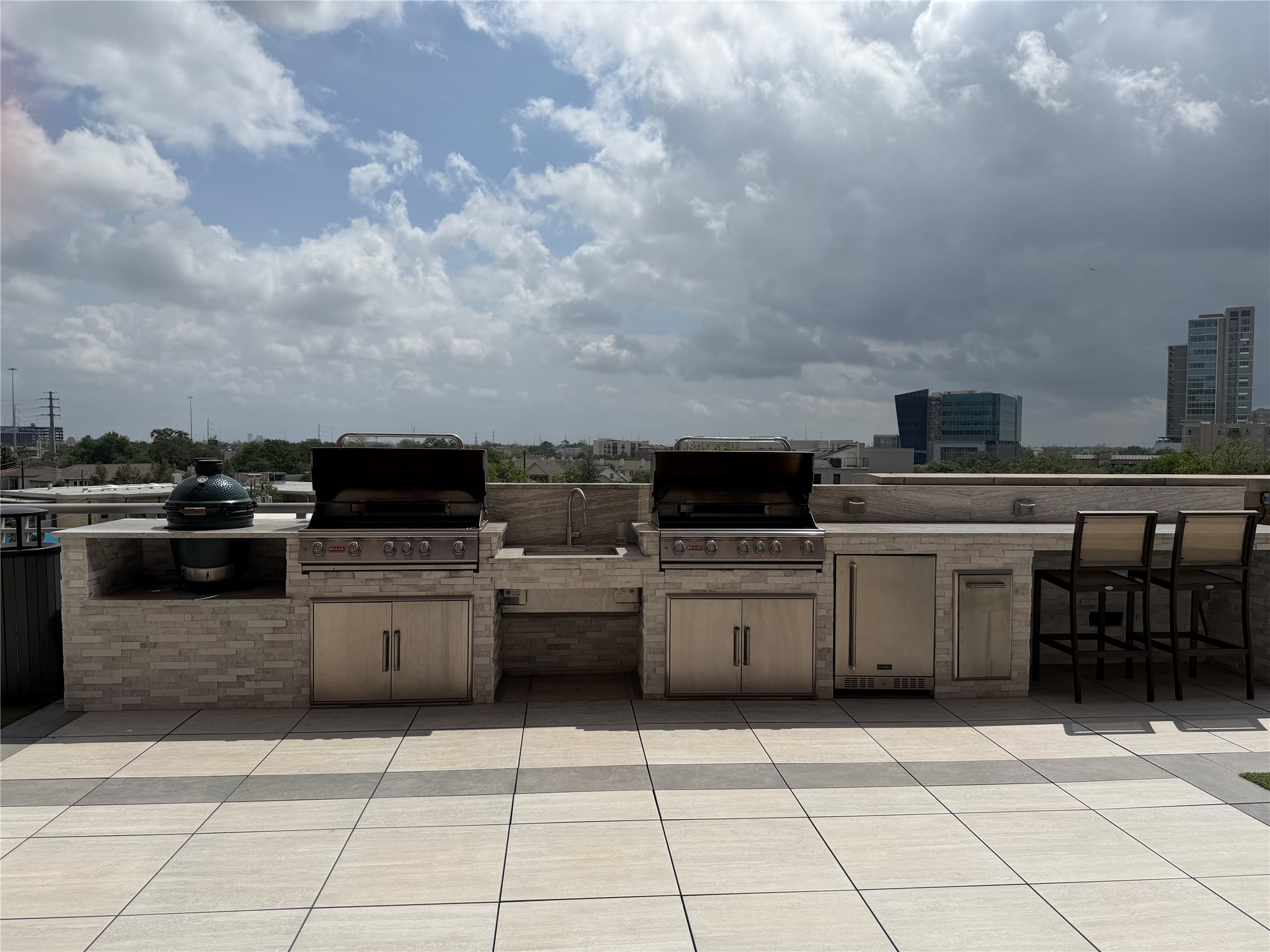 Gas grills, smoker and mini fridge available in the pool area