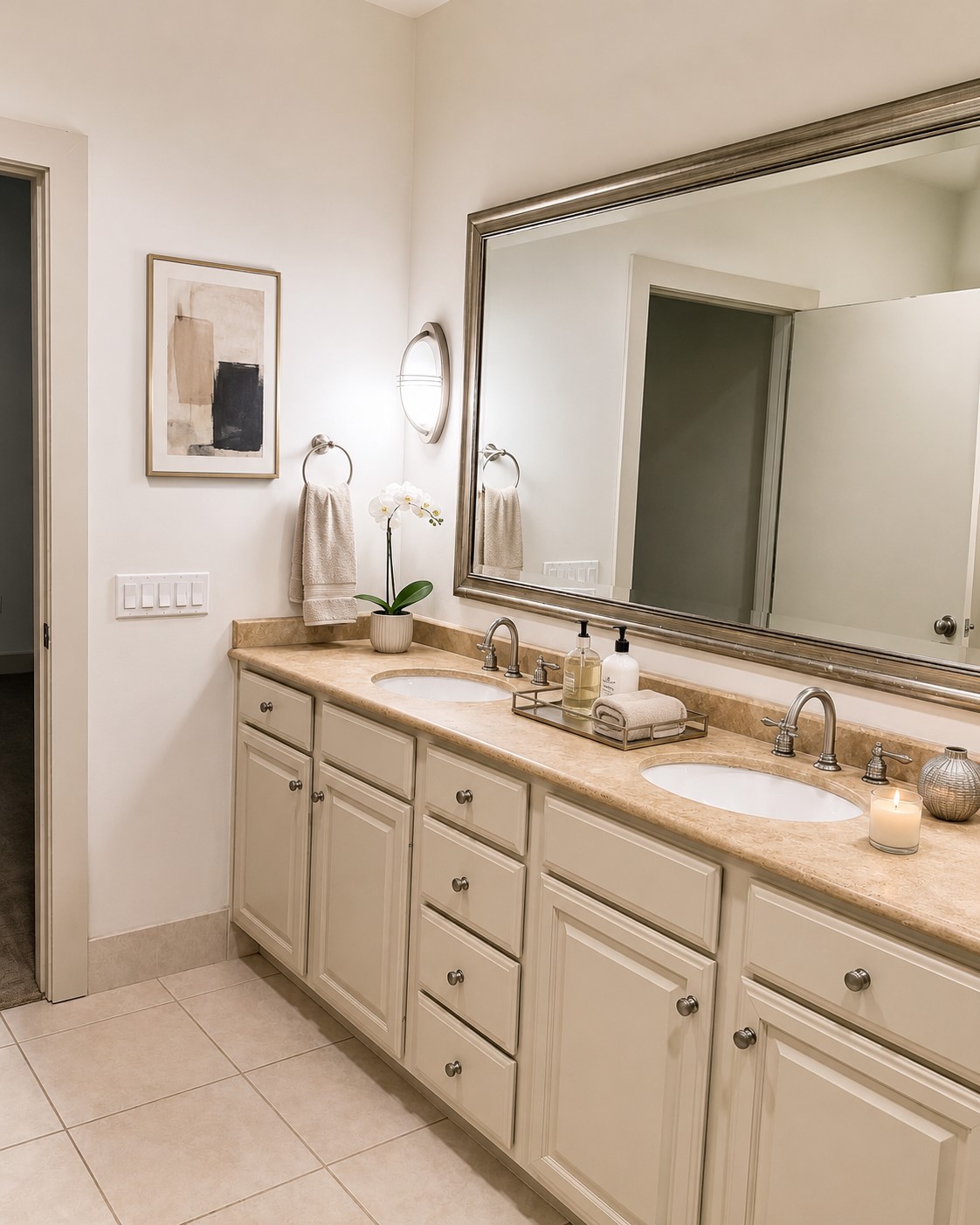 Note the extra storage in the vanity area, oversized framed mirror and frameless walk-in shower. Separate deep soaking tub.
