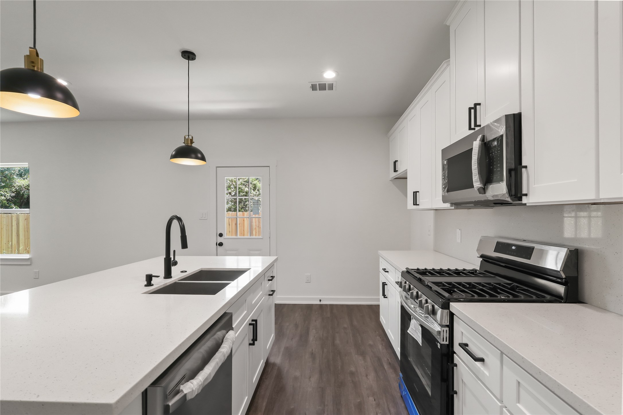 Beautiful Kitchen with appliances andQuartz Countertops