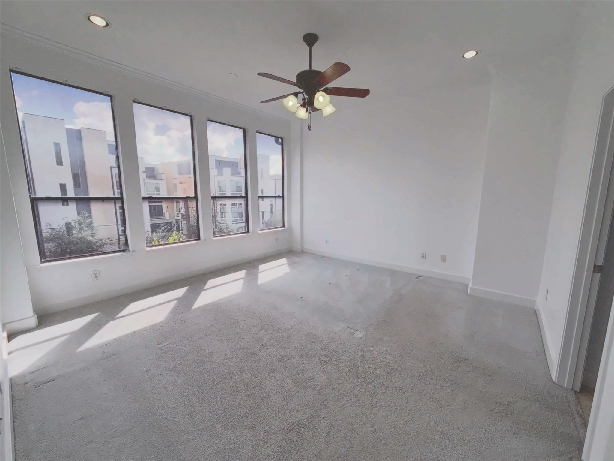 Primary bedroom on the third floor offer plenty of natural light.