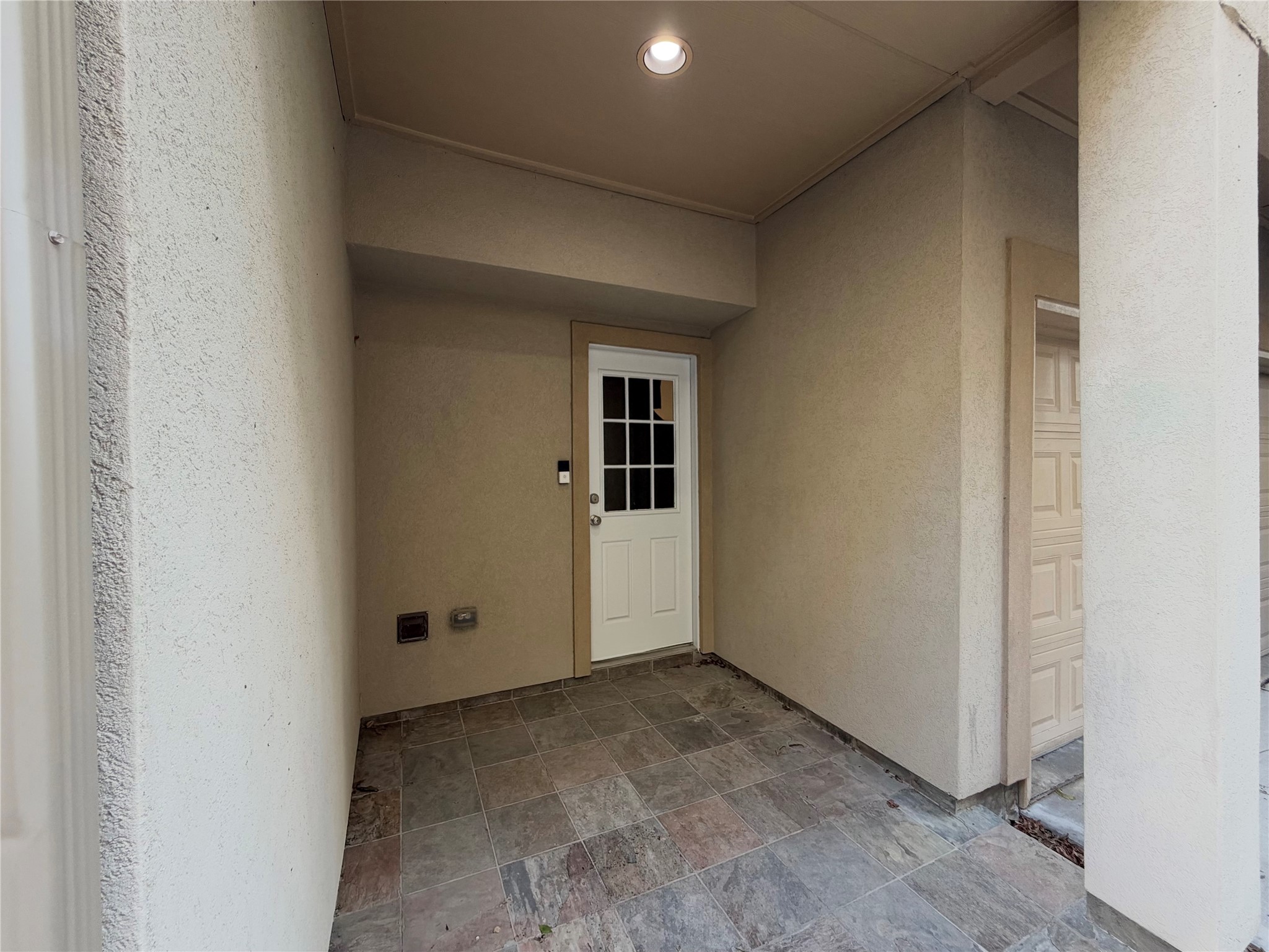 Entry into the home from the driveway entry side.