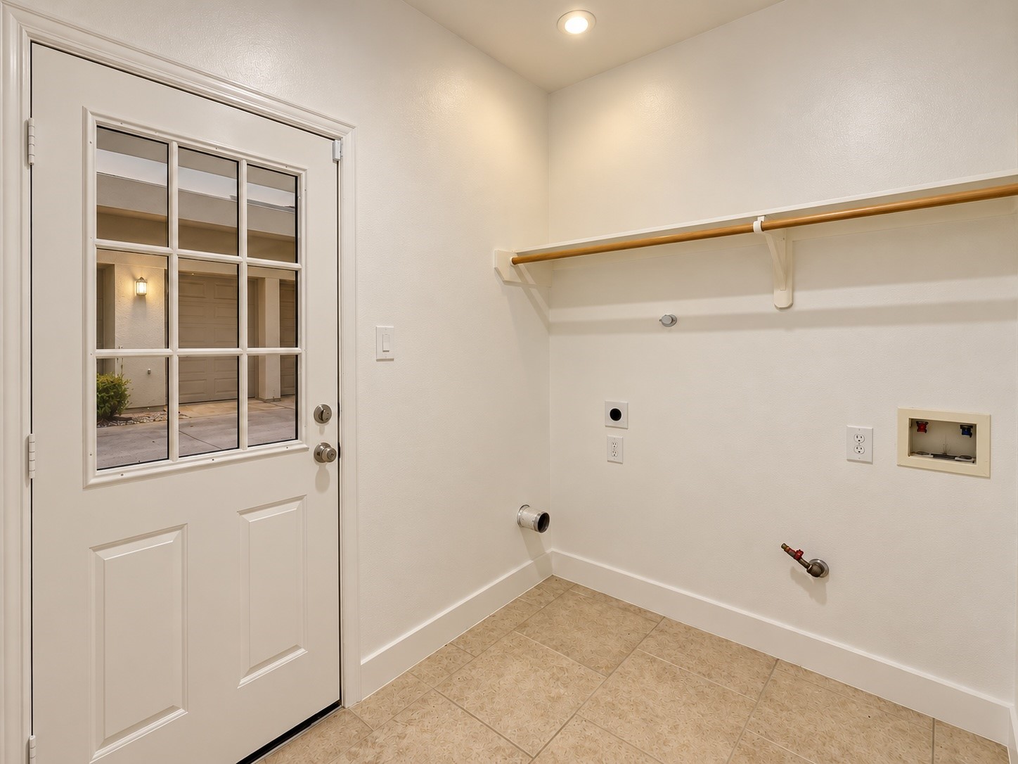 Utility room on the first floor with gas dryer hook up.