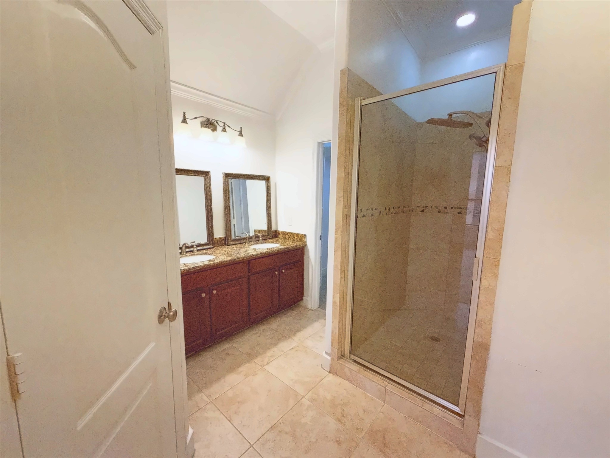 Primary has a double sink area with separate shower.