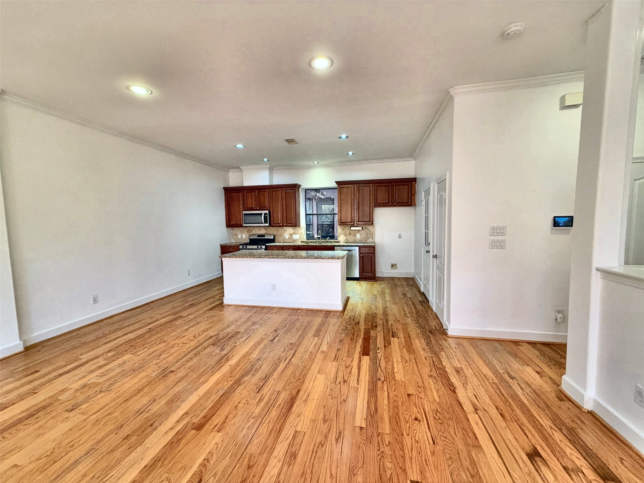 Kitchen offers gas range and a built-in microwave with an island that offers plenty of counter space.