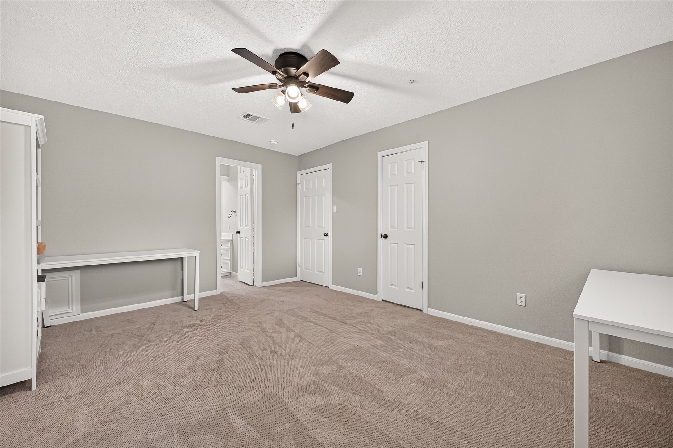 Another view of the 3rd upstairs bedroom. The open door leads to a full bathroom.