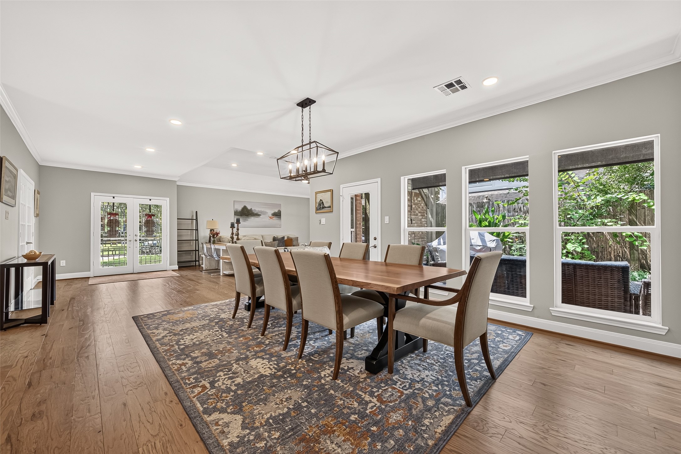 Glass door to the right leads to a covered patio.
