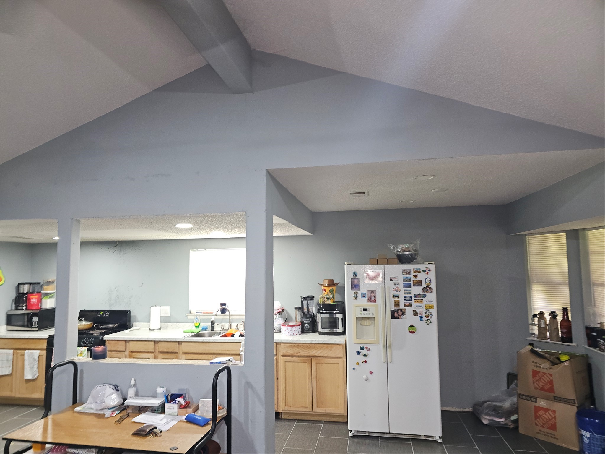 Open layout connects the kitchen, dining, and living areas, creating a functional space for everyday living and entertaining.