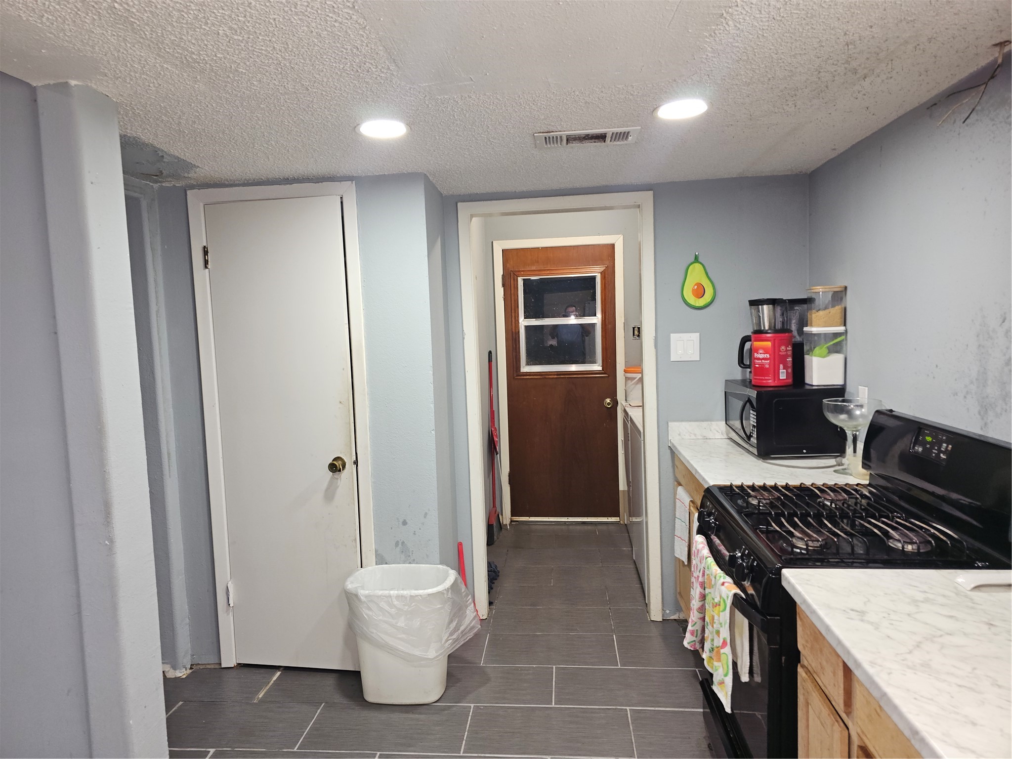Ample countertop space and a gas range make this kitchen functional for everyday cooking and meal preparation.