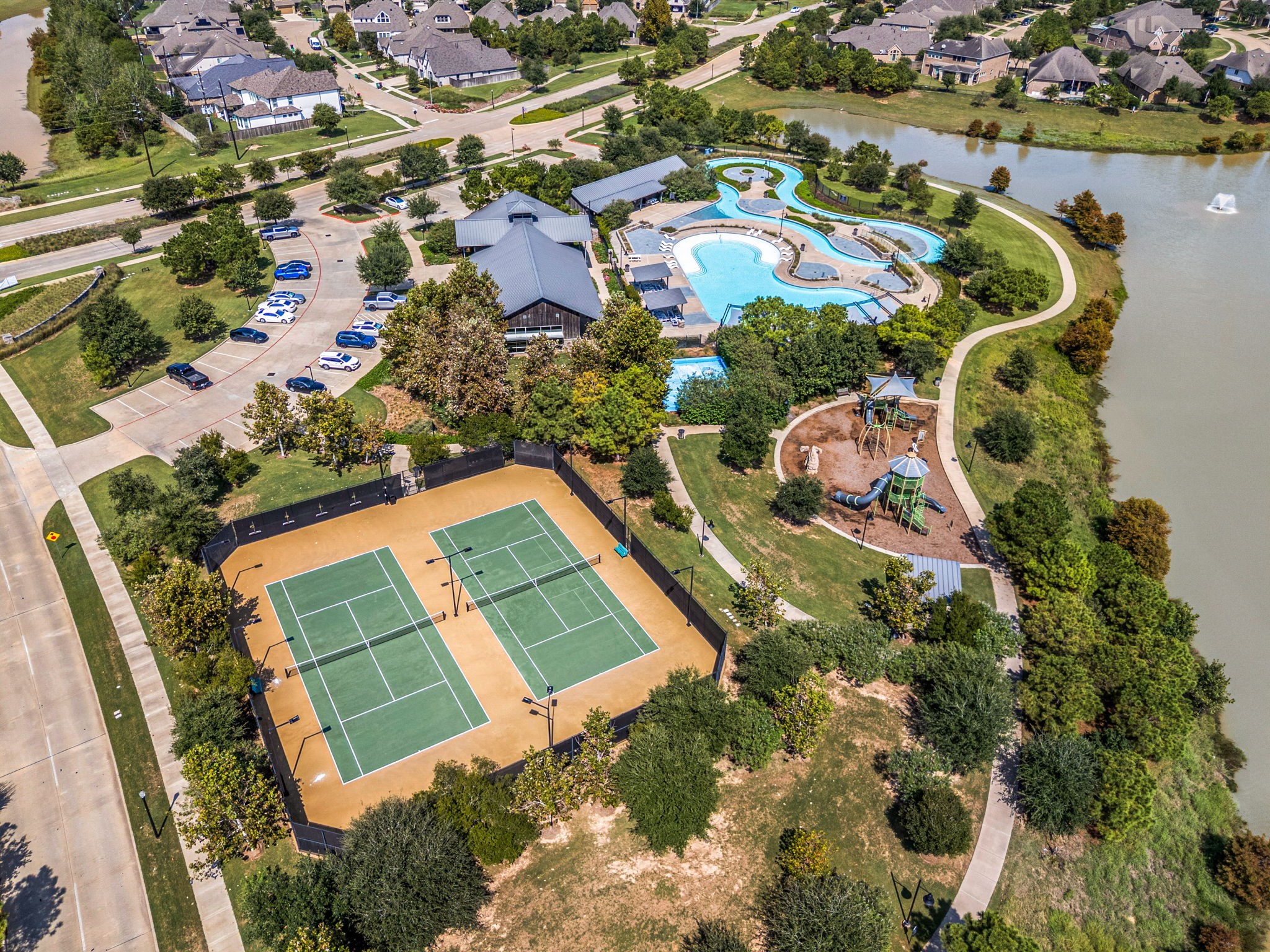 Tennis courts, playground, and walking lake trails