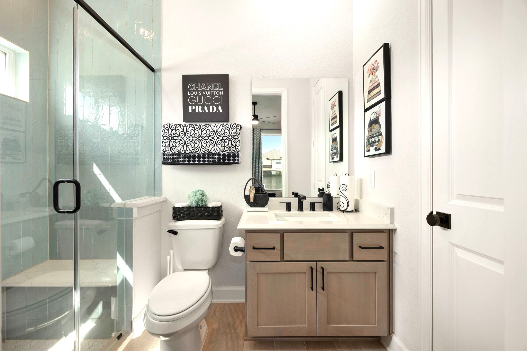 The private guest ensuite features a spacious walk-in shower with a built-in bench and a dedicated closet, creating a comfortable, thoughtfully designed retreat for guests or extended family.