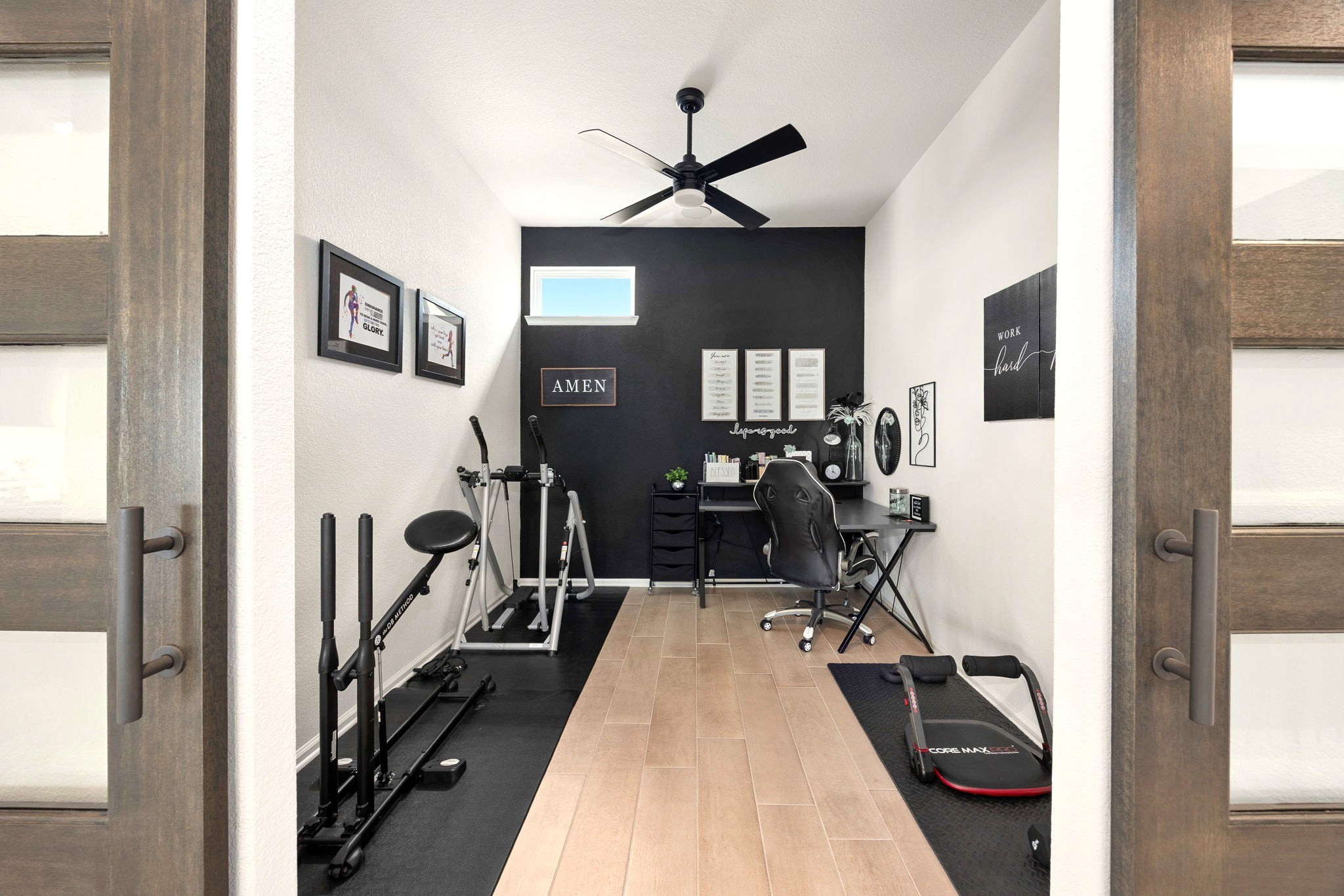 A custom sliding barn door opens to a versatile flex room, ideal for a guest bedroom, private home office, fitness studio, or creative retreat, offering exceptional flexibility to accommodate your lifestyle and evolving needs.