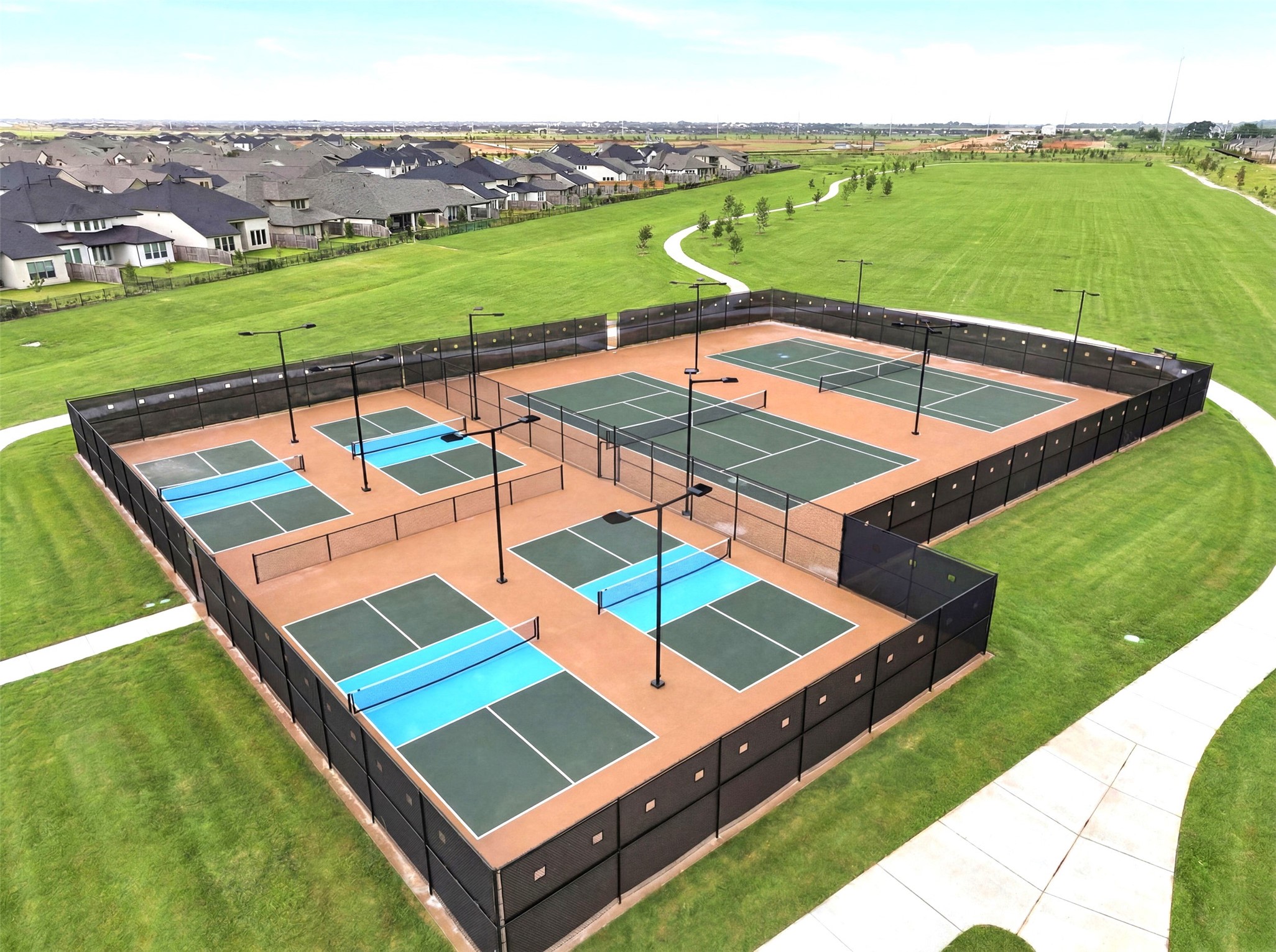 Pickleball courts with evening lights