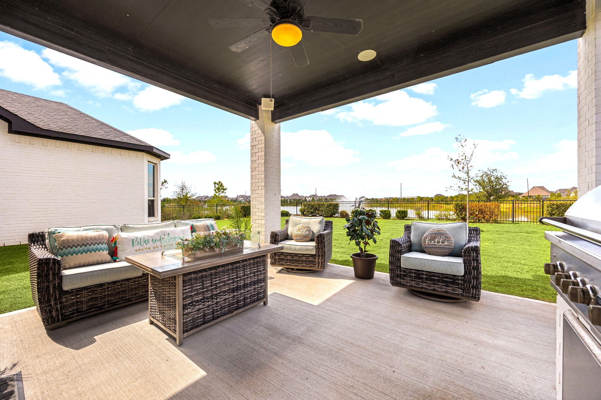 Enjoy peaceful lake views from the covered patio, enhanced by integrated surround sound speakers that create the perfect atmosphere for outdoor entertaining, relaxing evenings, and luxurious lakeside living.