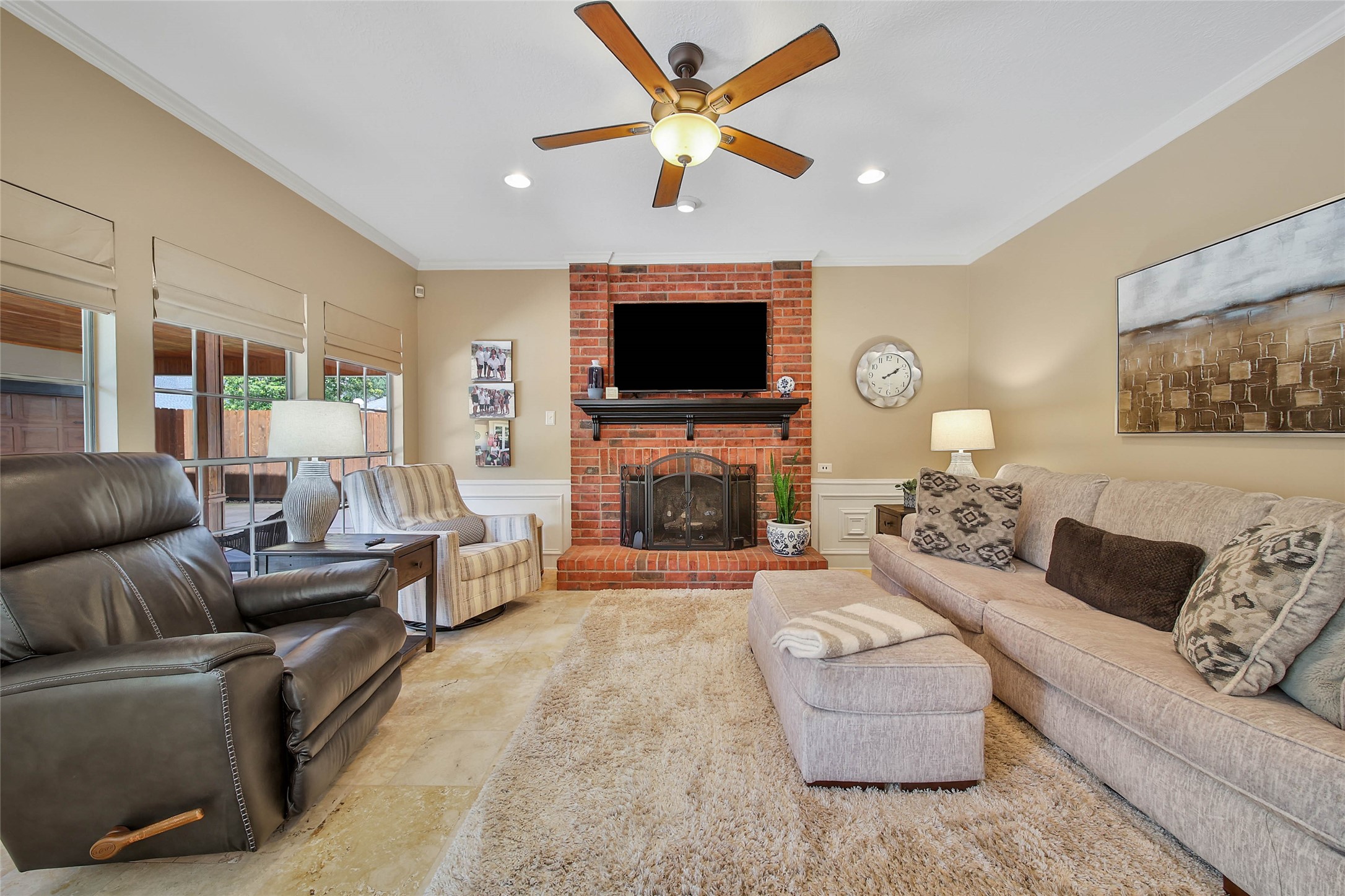 Comfortable family room anchored by a brick fireplace and positioned just off the kitchen for easy everyday living.