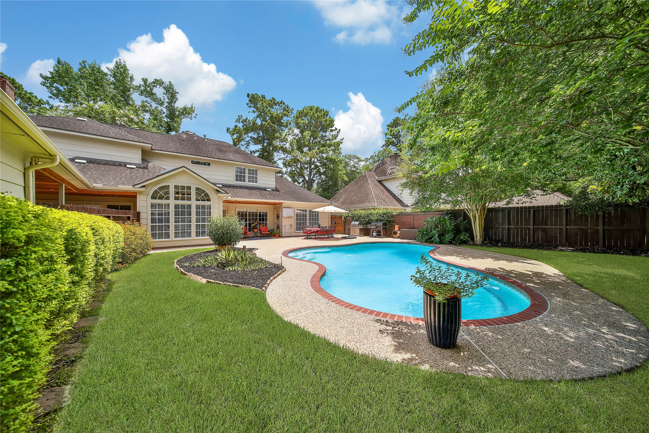 Private backyard pool creates a resort-like recreation space just beyond the main living areas.