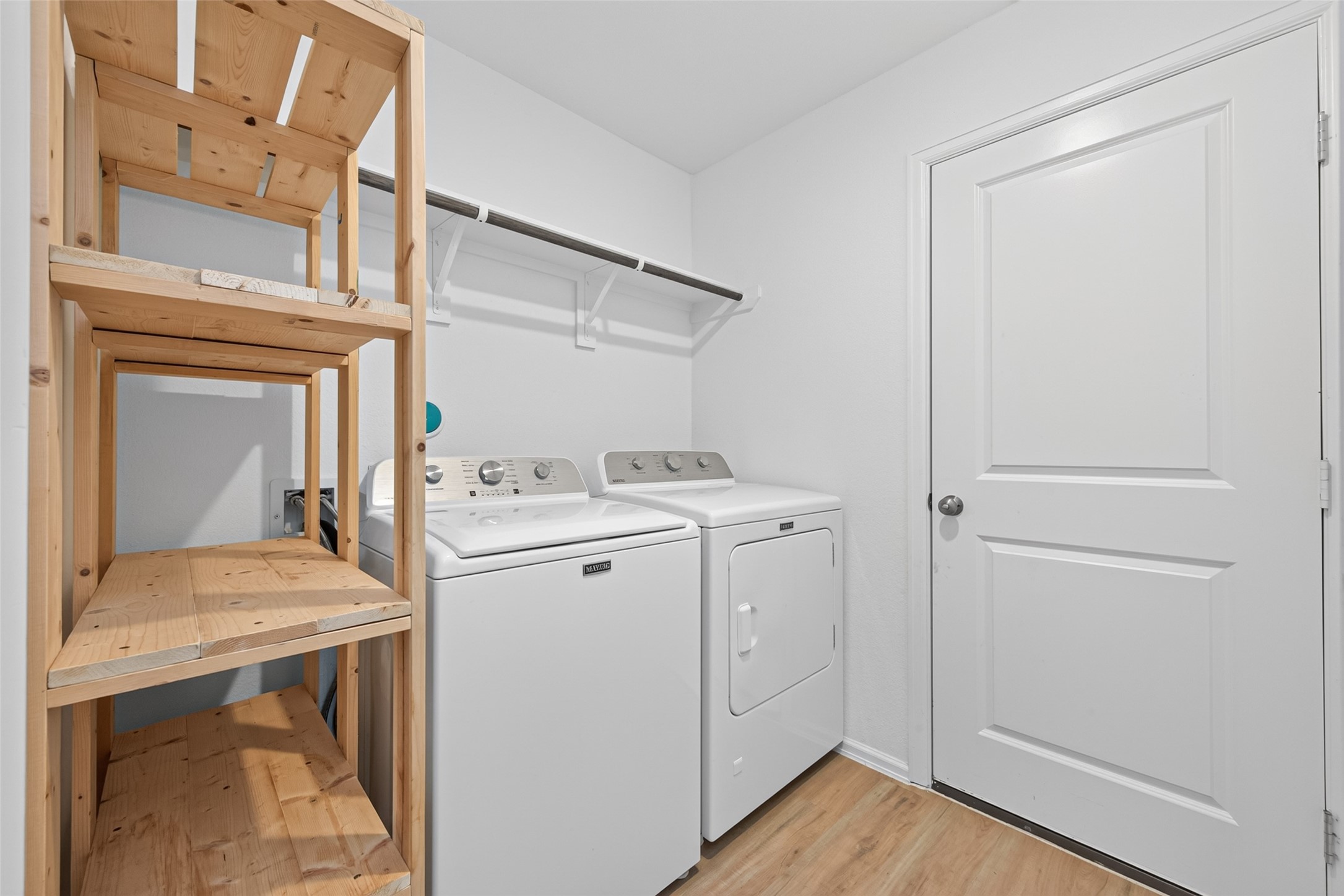 Washer and Dryer Room with Custom Built in Shelves