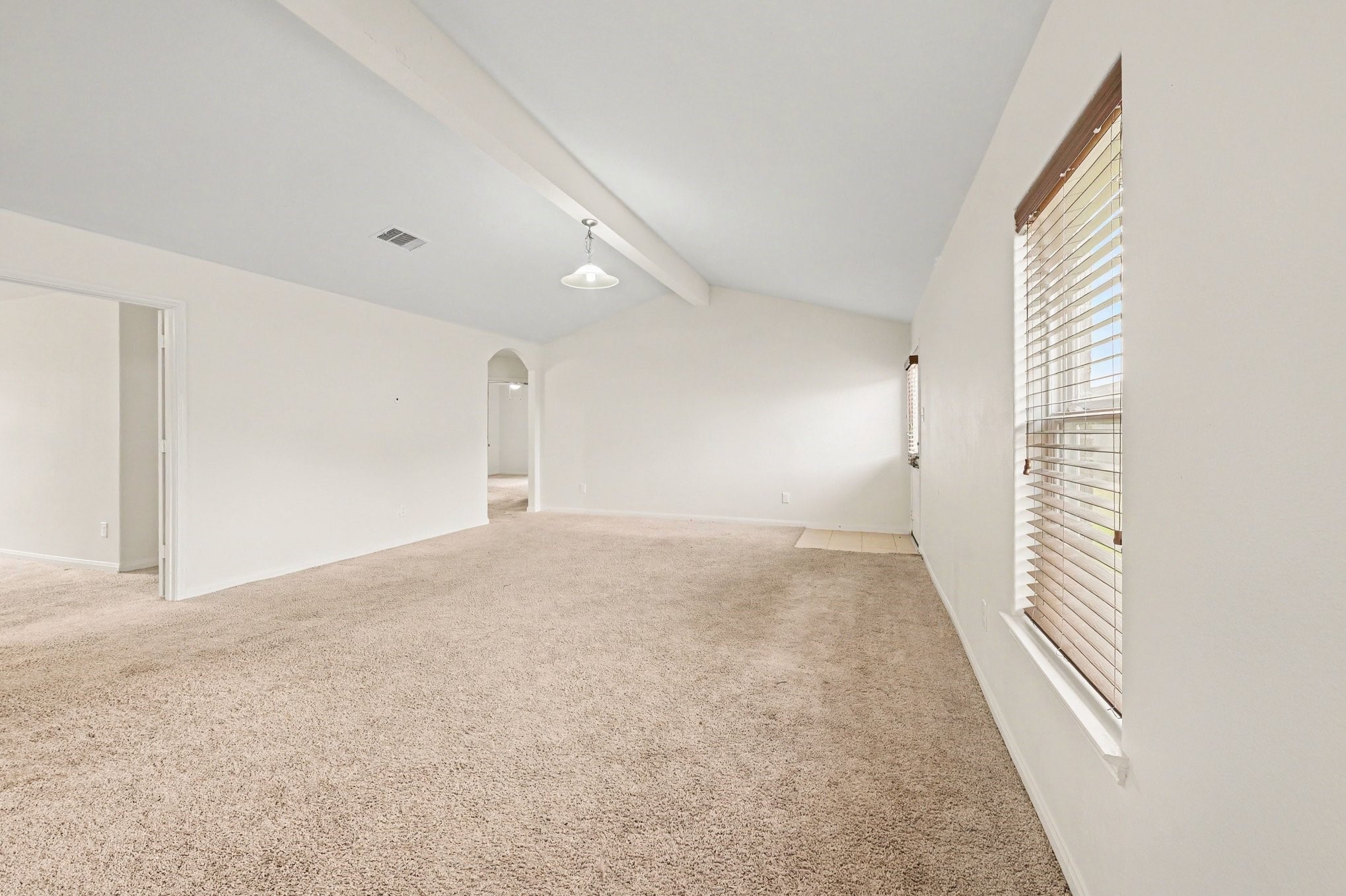 Living Room with vaulted ceilings that bring in plenty of natural light.
