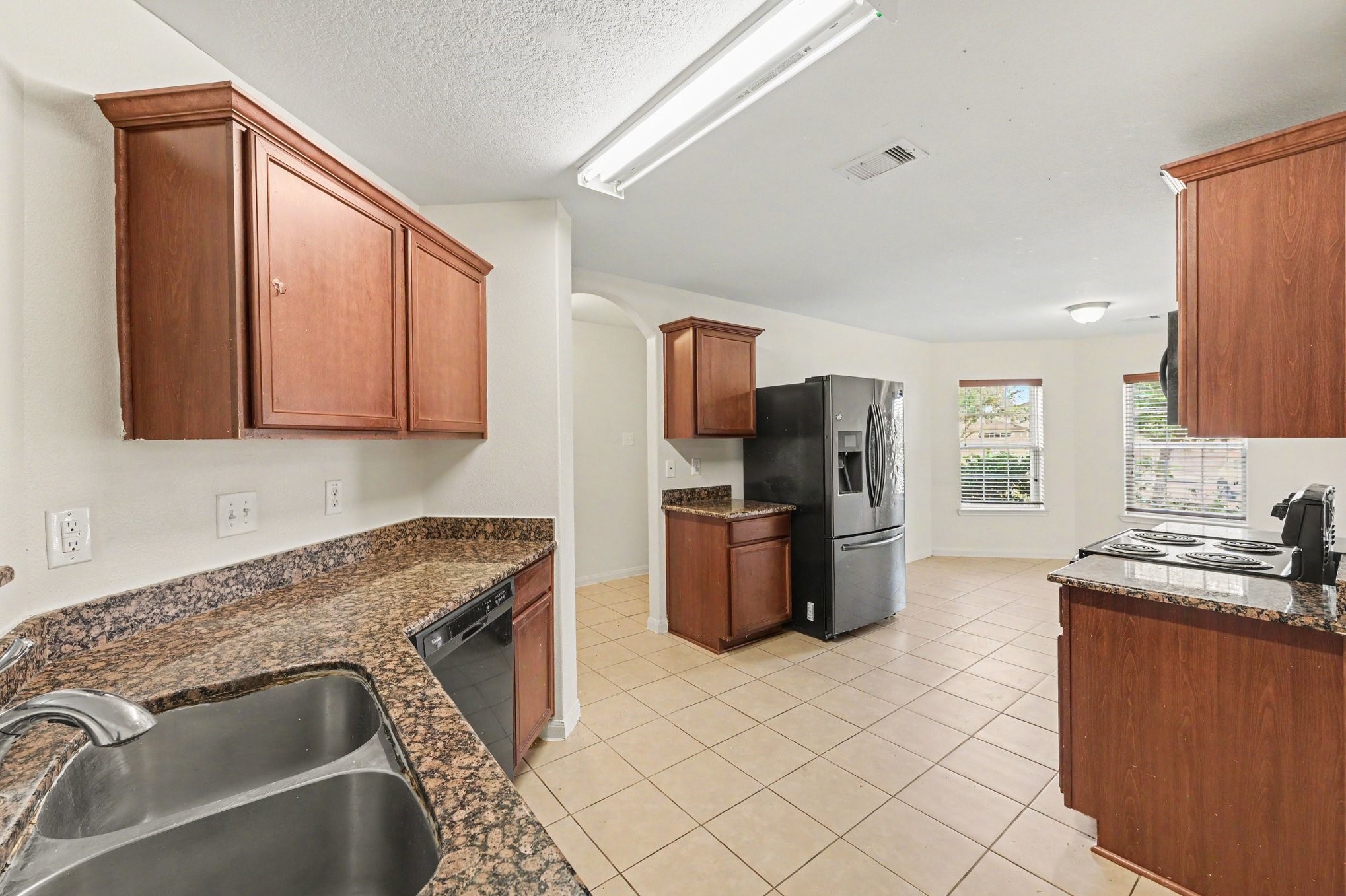 Inviting kitchen with rich wood cabinetry and plenty of counter space.