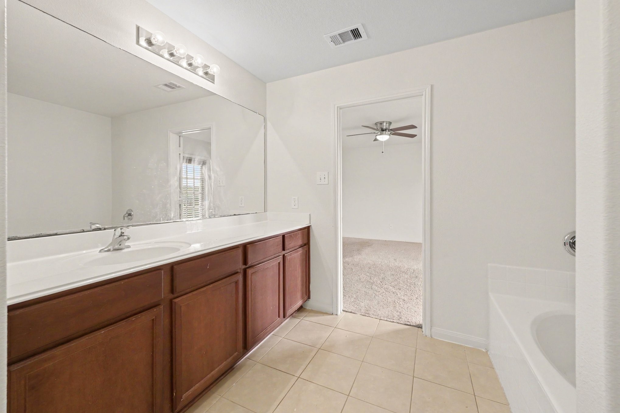 Spacious Primary Bathroom with separate stand-alone shower.