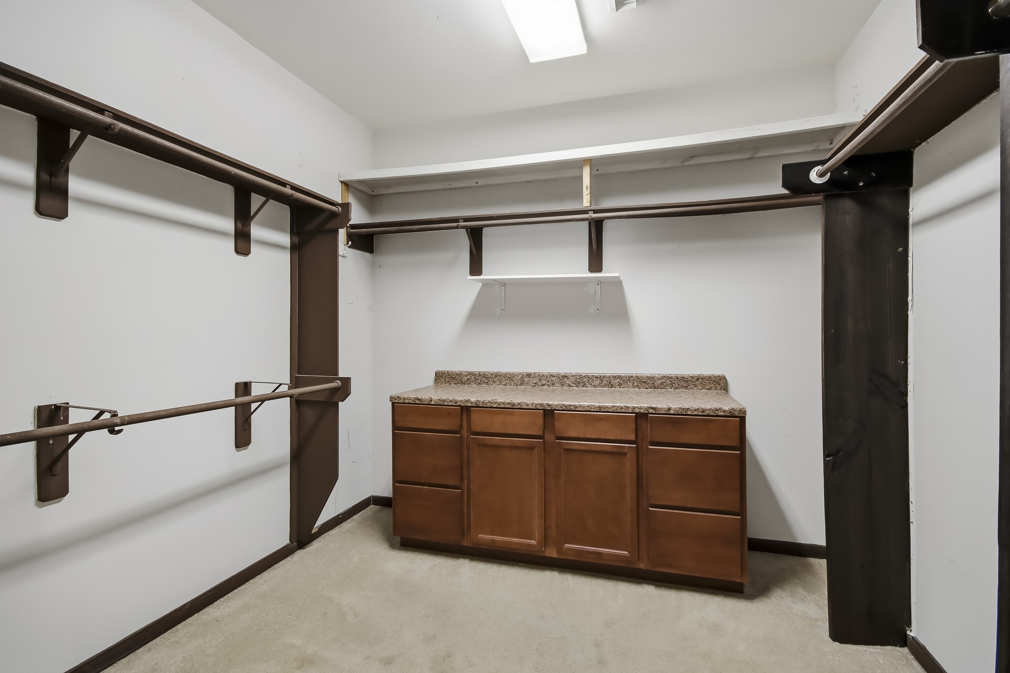 Gorgeous, oversized walk-in closet offering an abundance of space for clothing, shoes, and accessories, with plenty of room to keep everything beautifully organized!