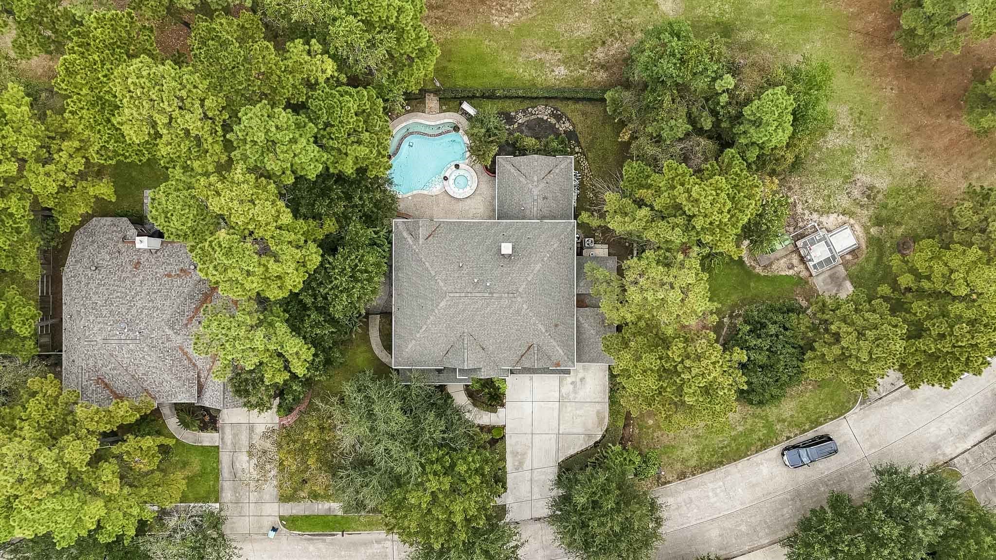 Beautiful birds-eye view of this peaceful neighborhood, where homes are situated on oversized lots surrounded by mature trees, offering exceptional privacy, tranquility, and plenty of room to enjoy!