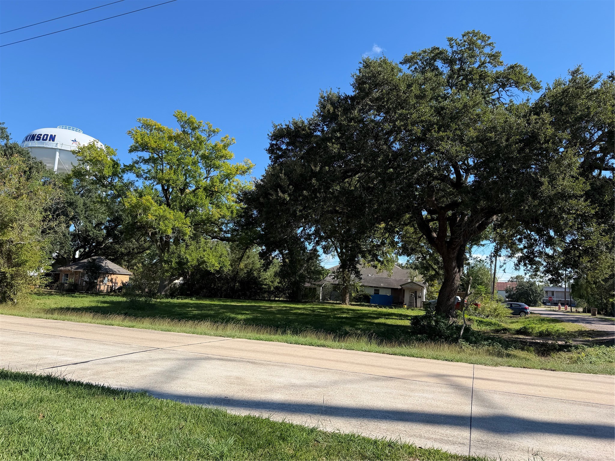 Natural Beauty and Neighborhood Charm!

Towering mature trees enhance the property's appeal, creating a picturesque backdrop for a future residence.