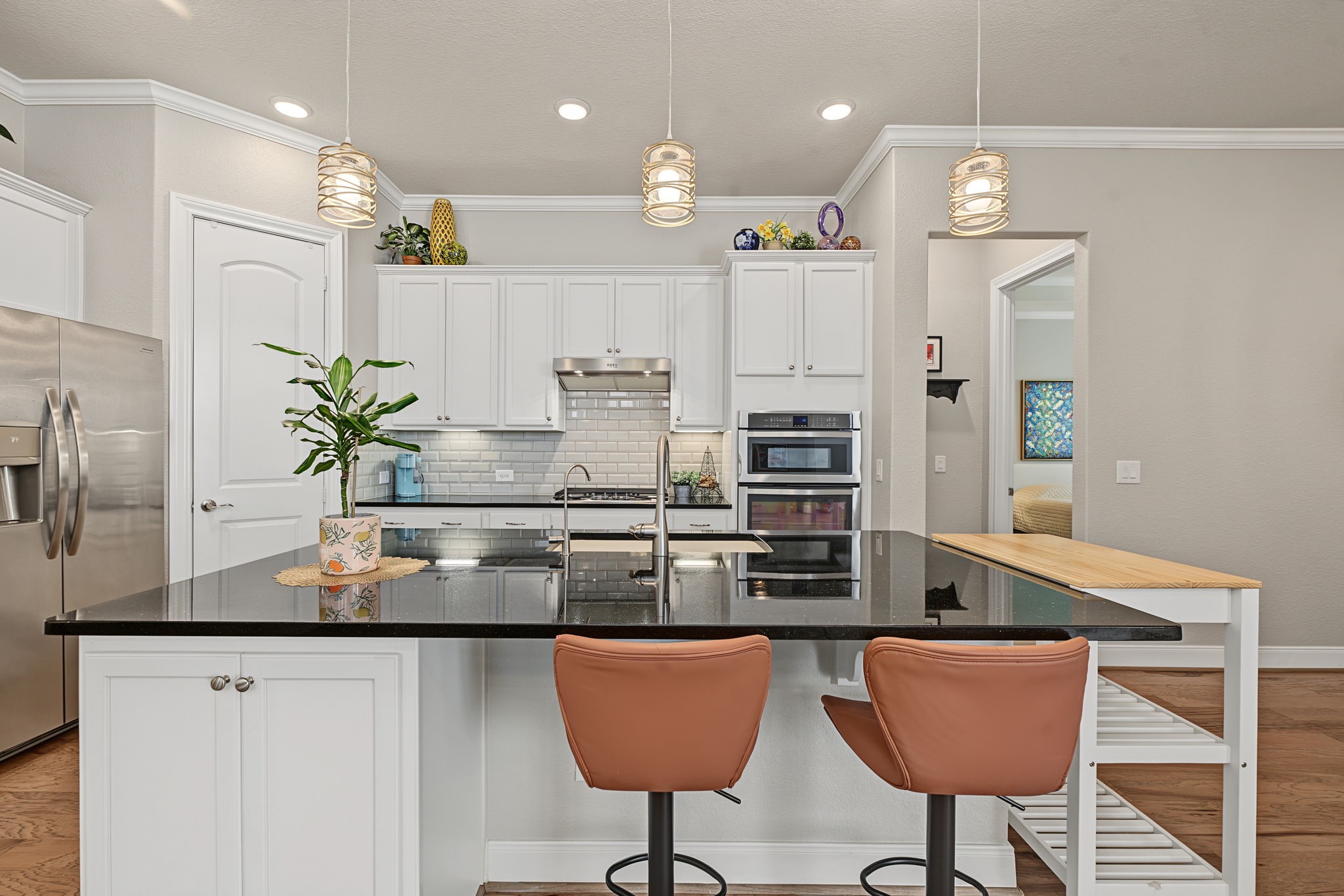 Granite countertops, abundant storage, walk-in pantry, SS appliances. Fridge stays!