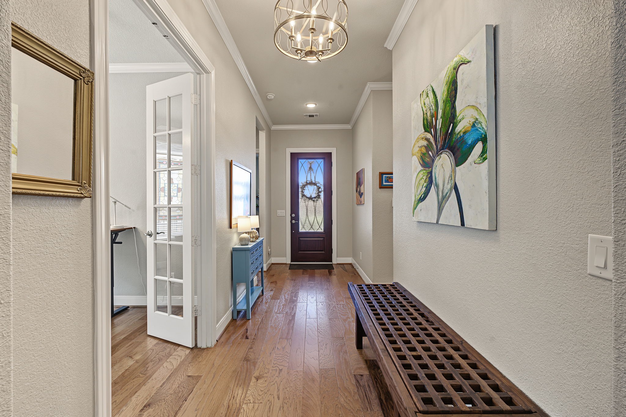Midway through the wide entryway, there is a Study/Office with double French doors.