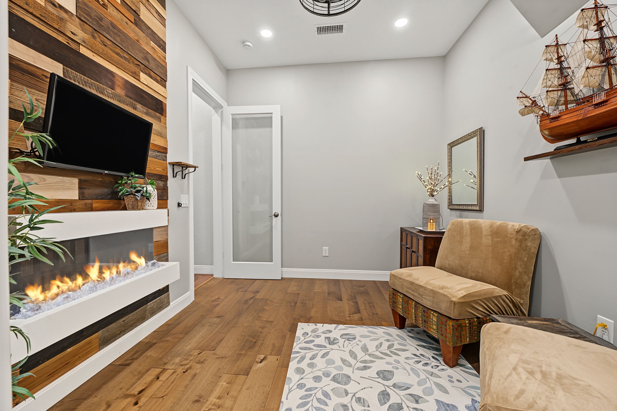 The bonus flex room has a private door, electric fireplace (color-changing!), full climate control, and recessed lighting.