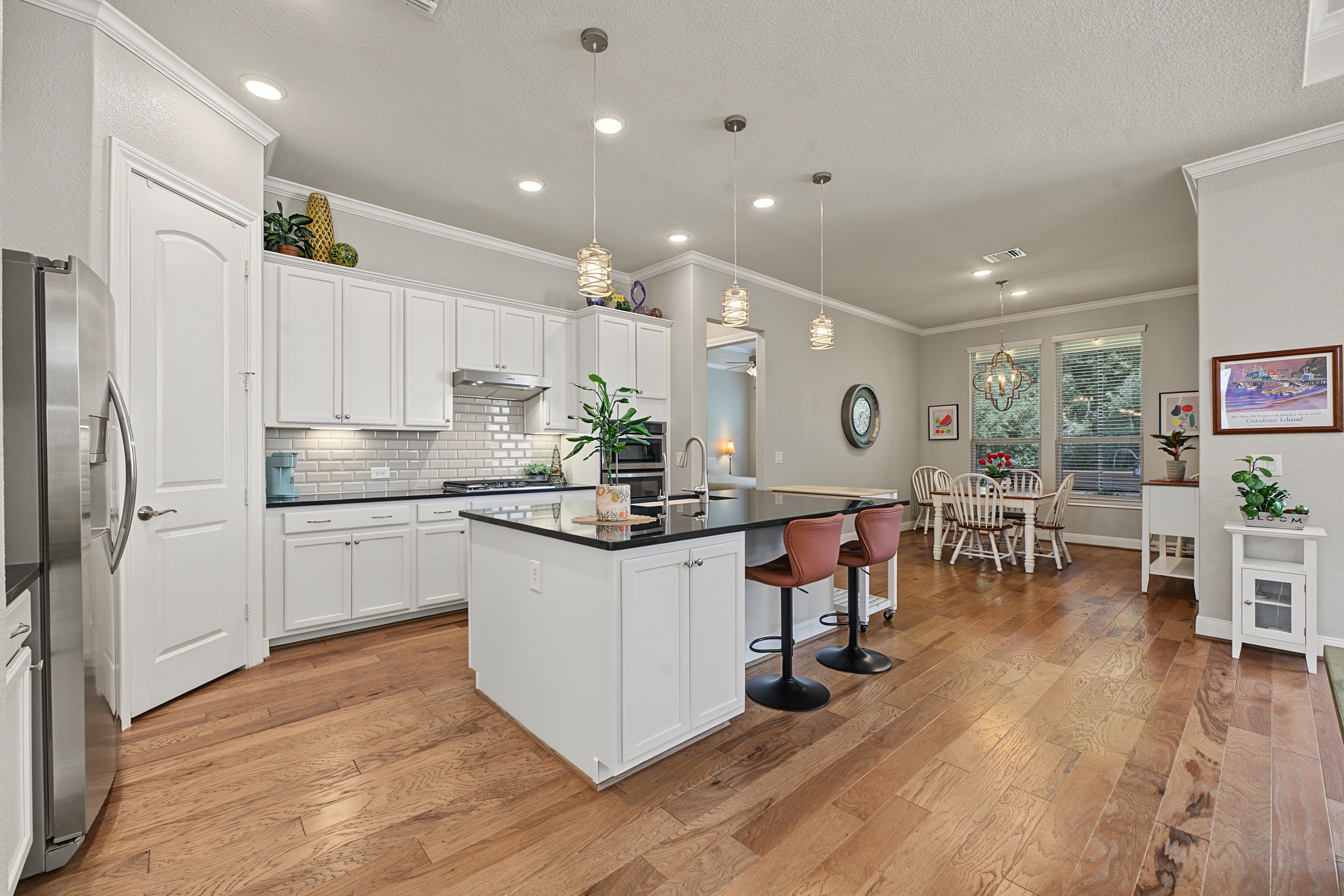 The Breakfast Room is in the rear with views out to the tree preserve.