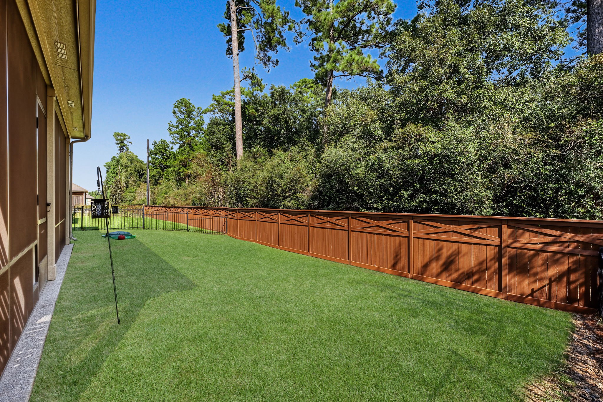 The backyard has good grass space, and easily manageable too. Full sprinkler system. No rear neighbors other than the birds in the trees.