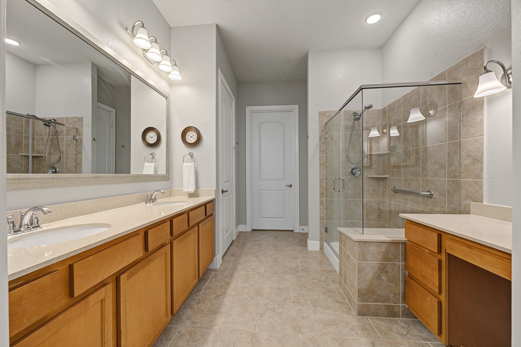 The Primary Bathroom has two sinks plus a separate vanity/storage area on the right.