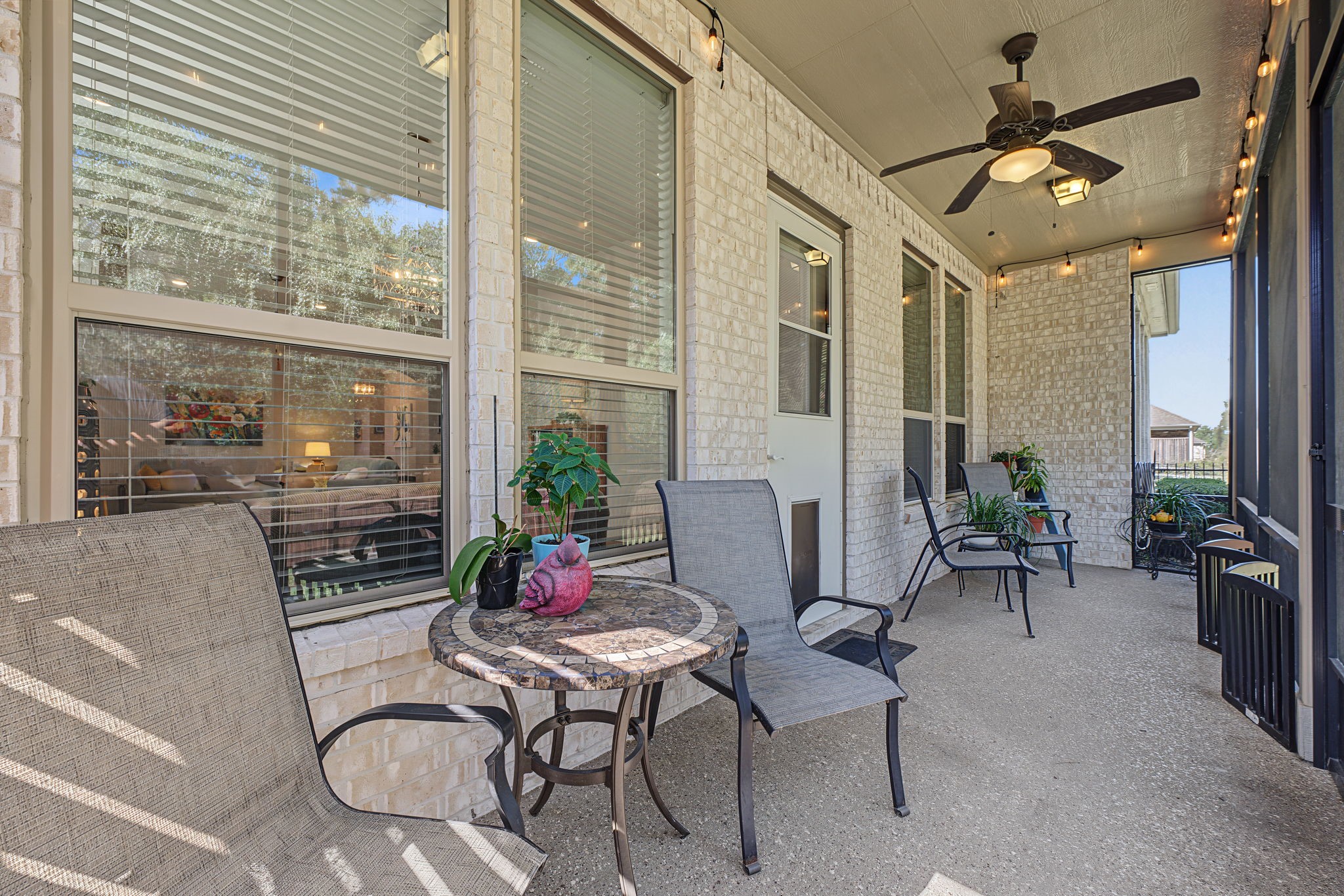 View from other corner of the back patio. The patio flooring is an epoxy-like surface on top of the concrete.
