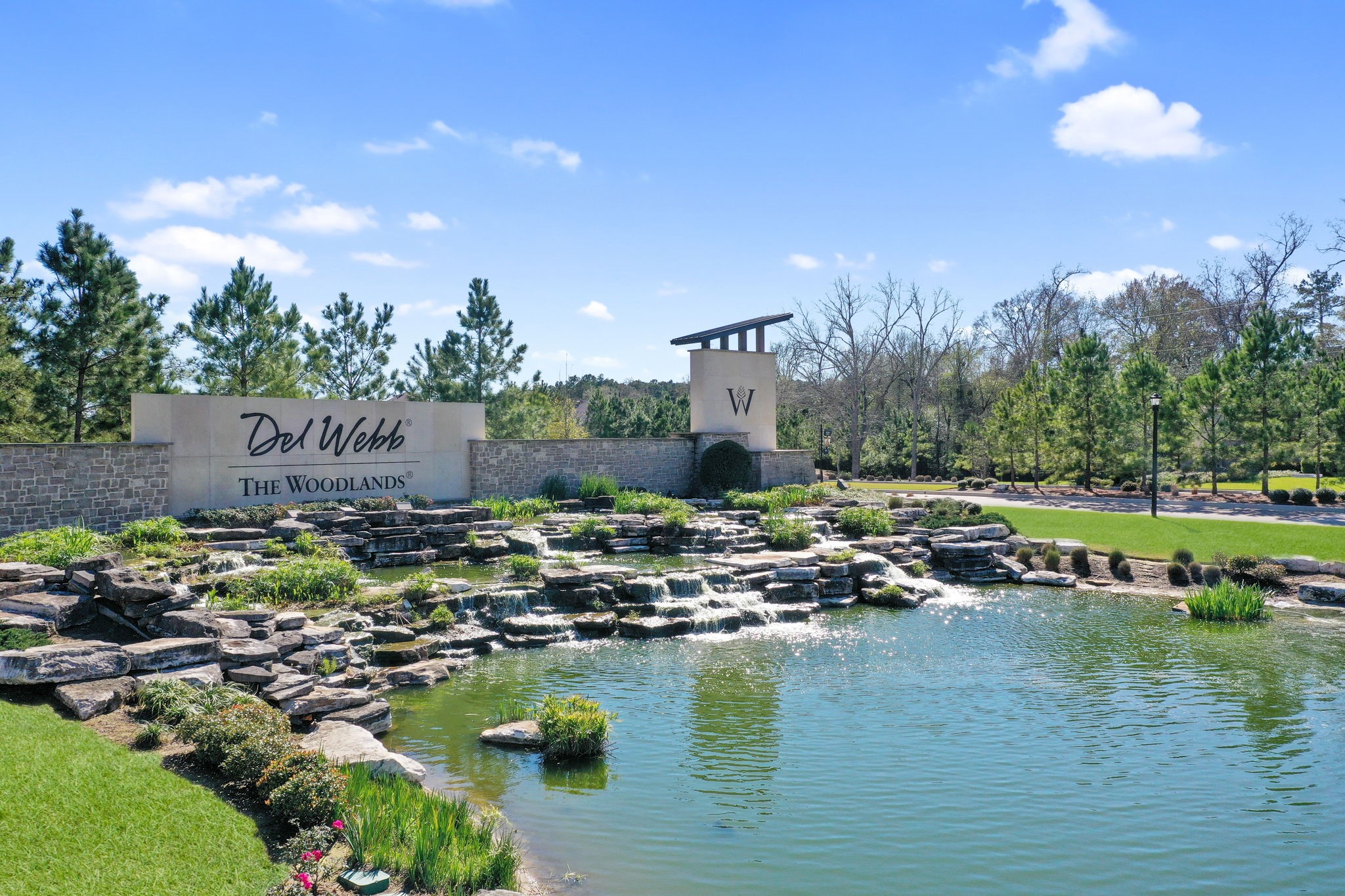 Look for the beautiful Dell Webb The Woodlands sign located off FM-1488 just north of The Woodlands.