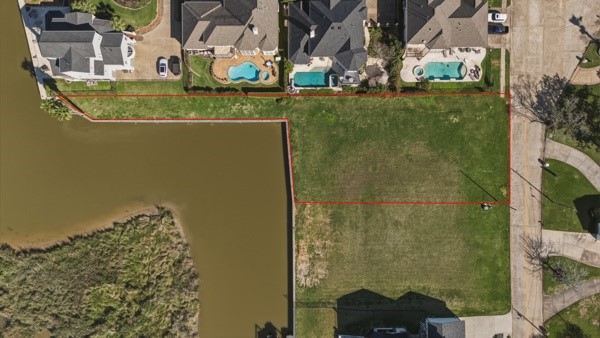 Includes long piece of land that goes behind the neighbors