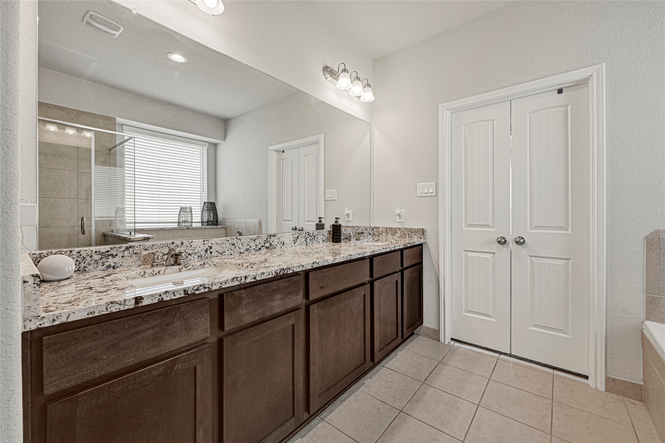 Primary Bathroom with Double Sinks & Granite Countertops