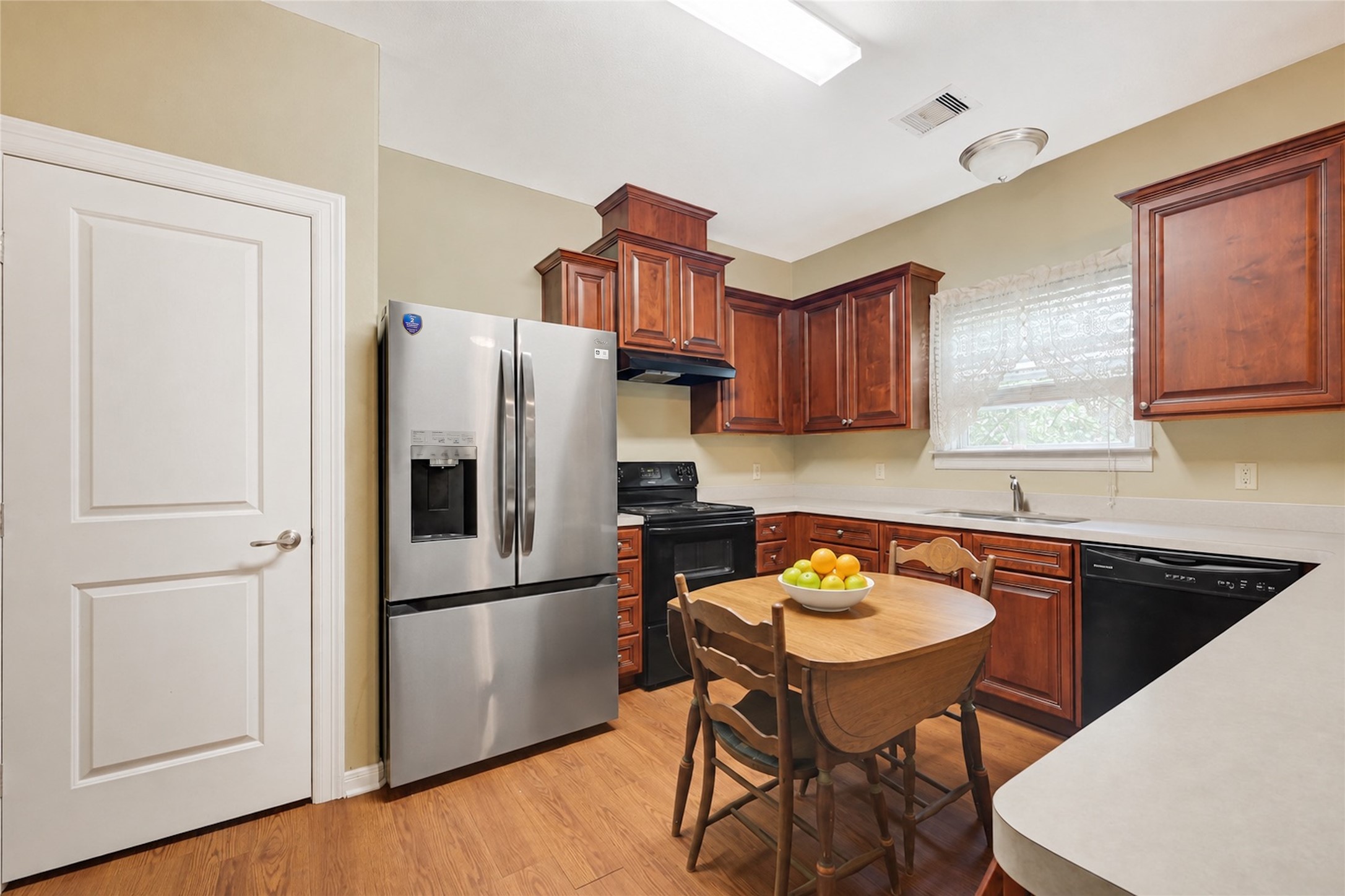 Check out this kitchen! Plenty of room to prep recipes and store items in the pantry.