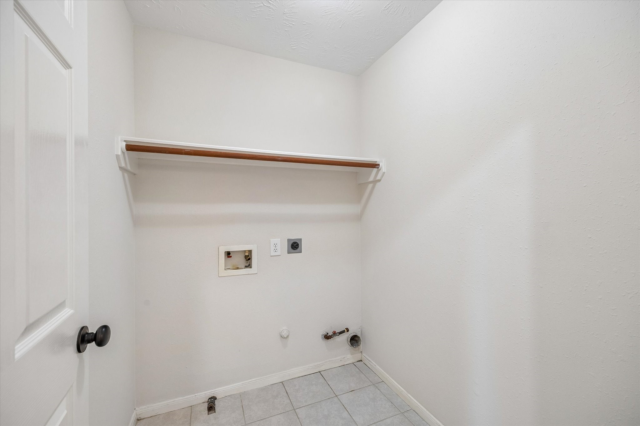 Conveniently located on the second level, the dedicated laundry space offers added convenience and functionality.